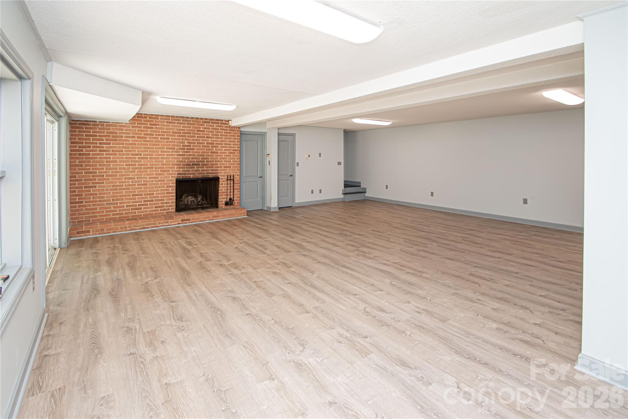 This expansive, versatile basement offers the perfect flex space, ideal for use as a playroom, home office, workout area, or customized recreational space. - 7400 Oakwood Lane, Charlotte