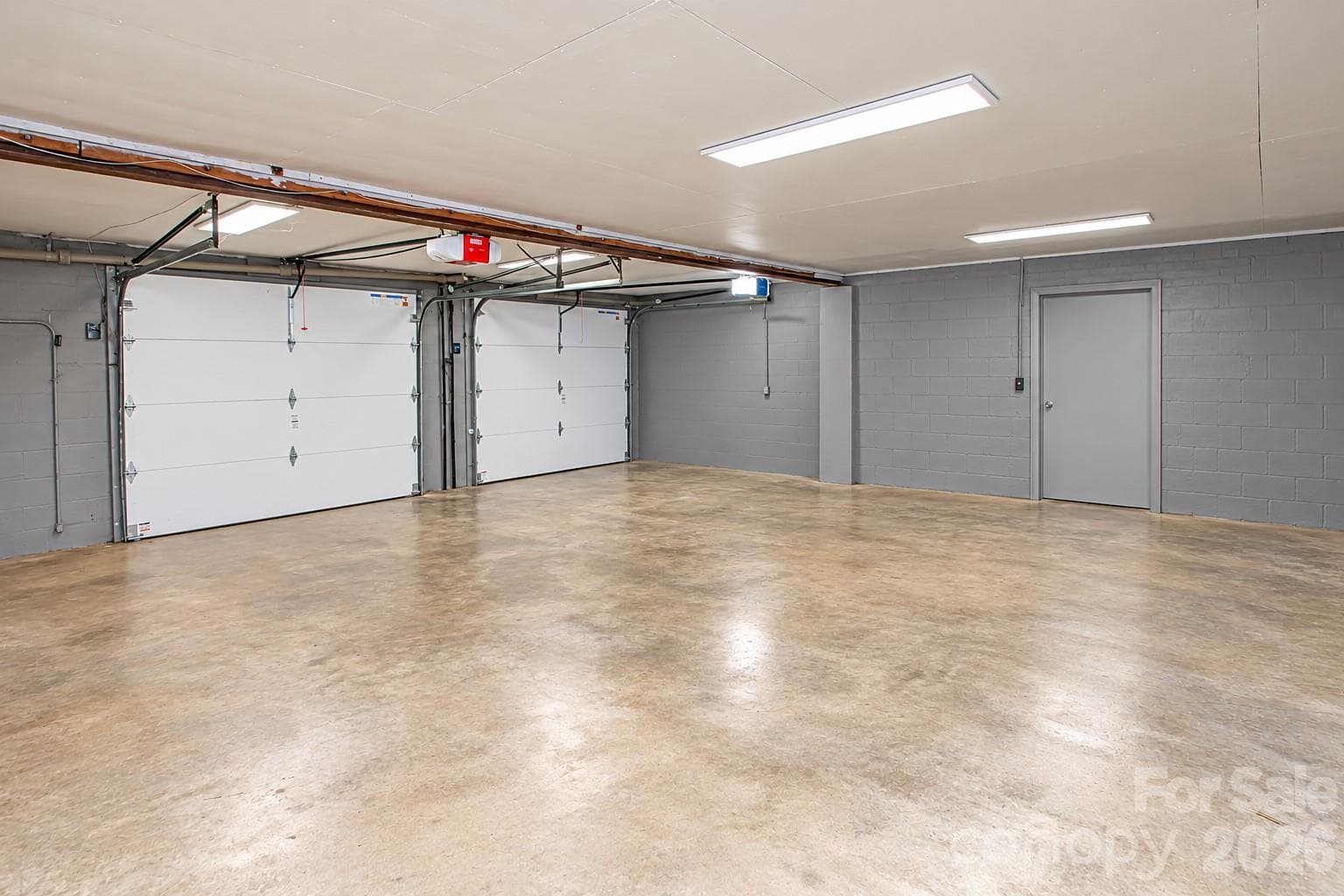 Make sure you open the door in the garage which goes to an extra room perfect for storage or workshop. - 7400 Oakwood Lane, Charlotte