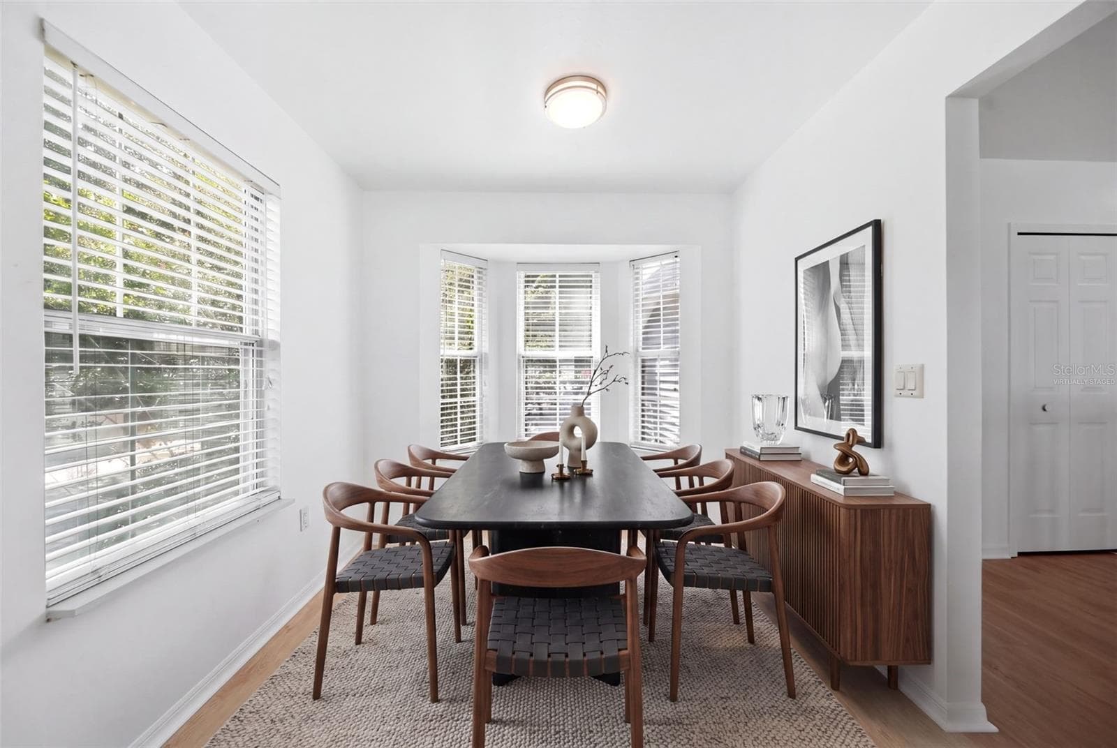 Virtually staged dining room - 2210 COACH HOUSE BLVD #408, ORLANDO
