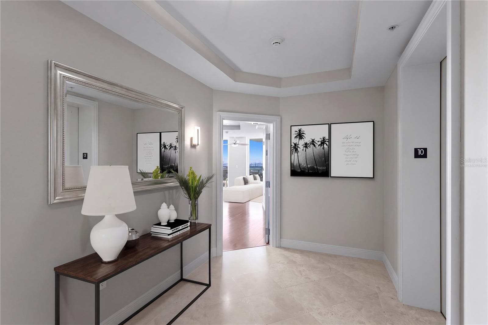 Virtually staged private entry foyer with two elevators. - 450 KNIGHTS RUN AVE #1004, TAMPA