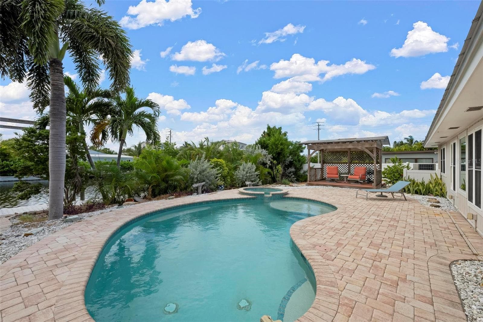 Heated saltwater pool, spa and pergola with southern exposure. - 503 65TH ST, HOLMES BEACH