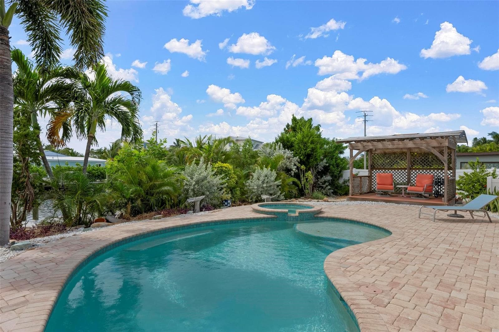 Heated saltwater pool, spa and pergola with southern exposure. - 503 65TH ST, HOLMES BEACH