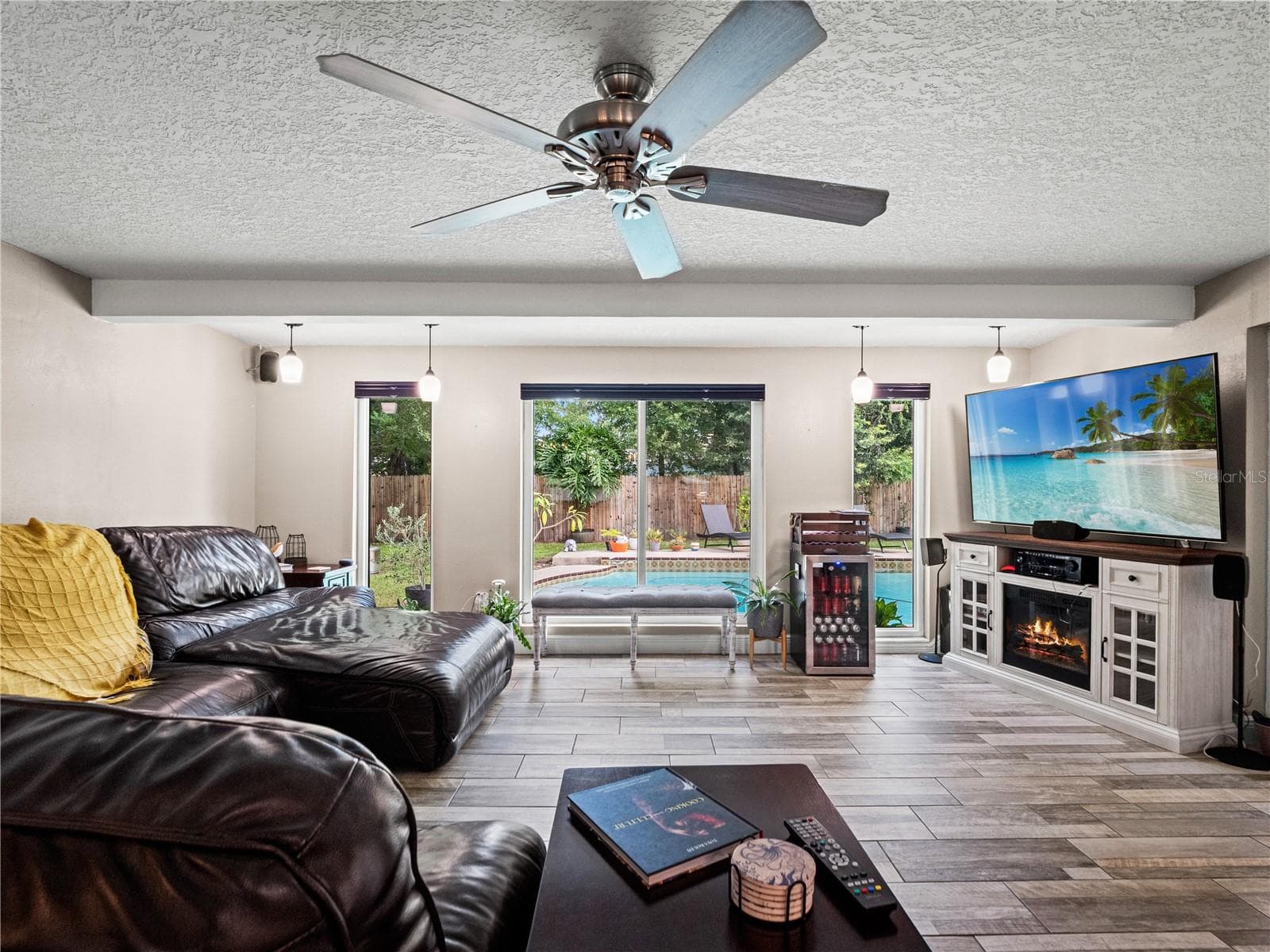 Spacious living room with views to outdoors. - 1210 CANBERRA AVE, ORLANDO