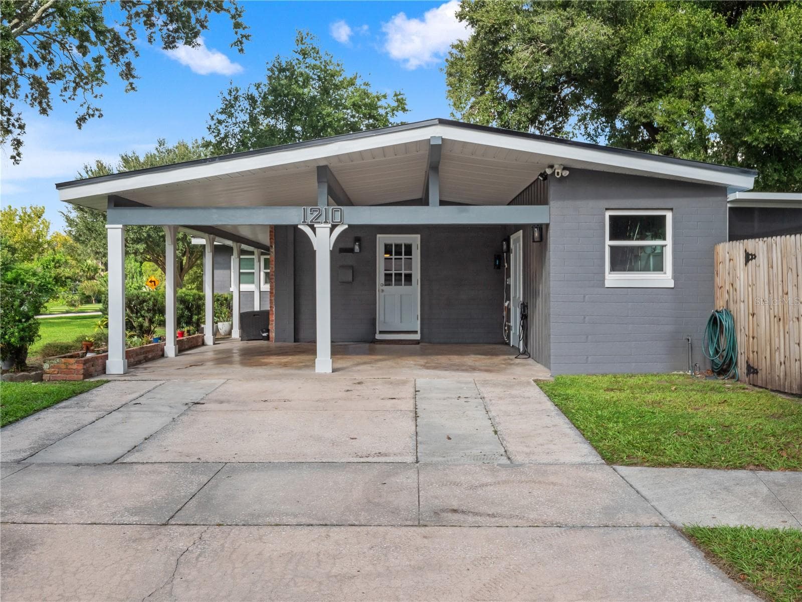 2 car covered carport with an outlet for an EV charger. - 1210 CANBERRA AVE, ORLANDO