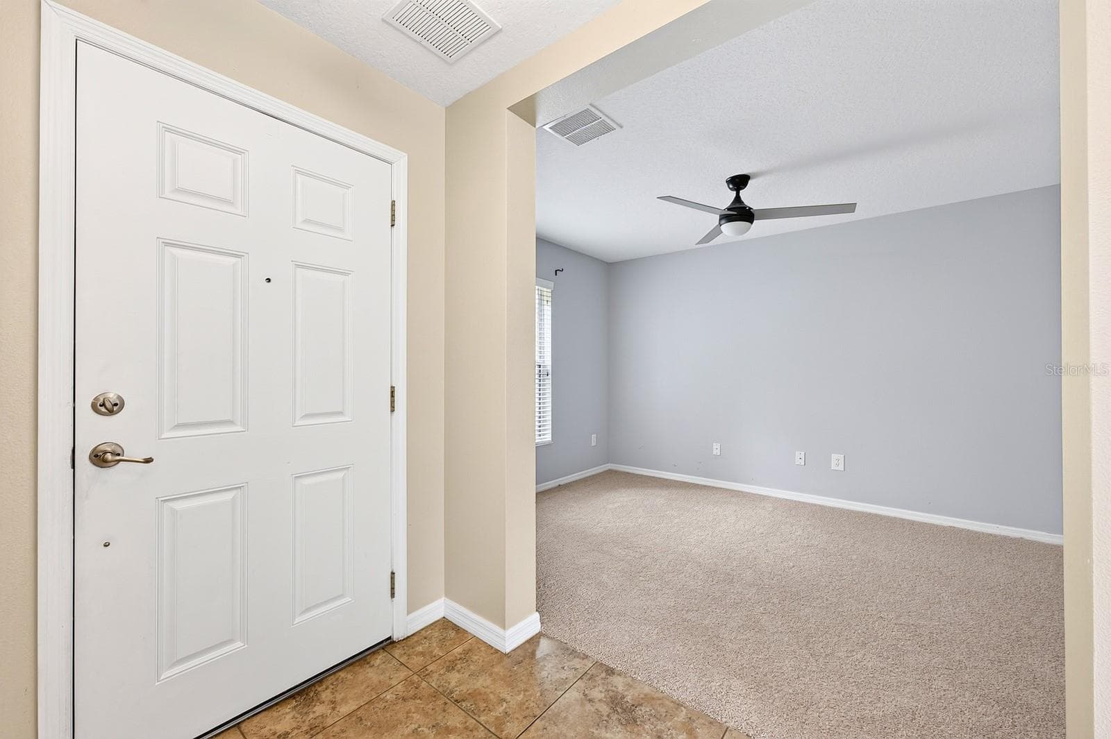 Foyer opens to a versatile formal or flex space. - 2564 ABEY BLANCO DR, ORLANDO