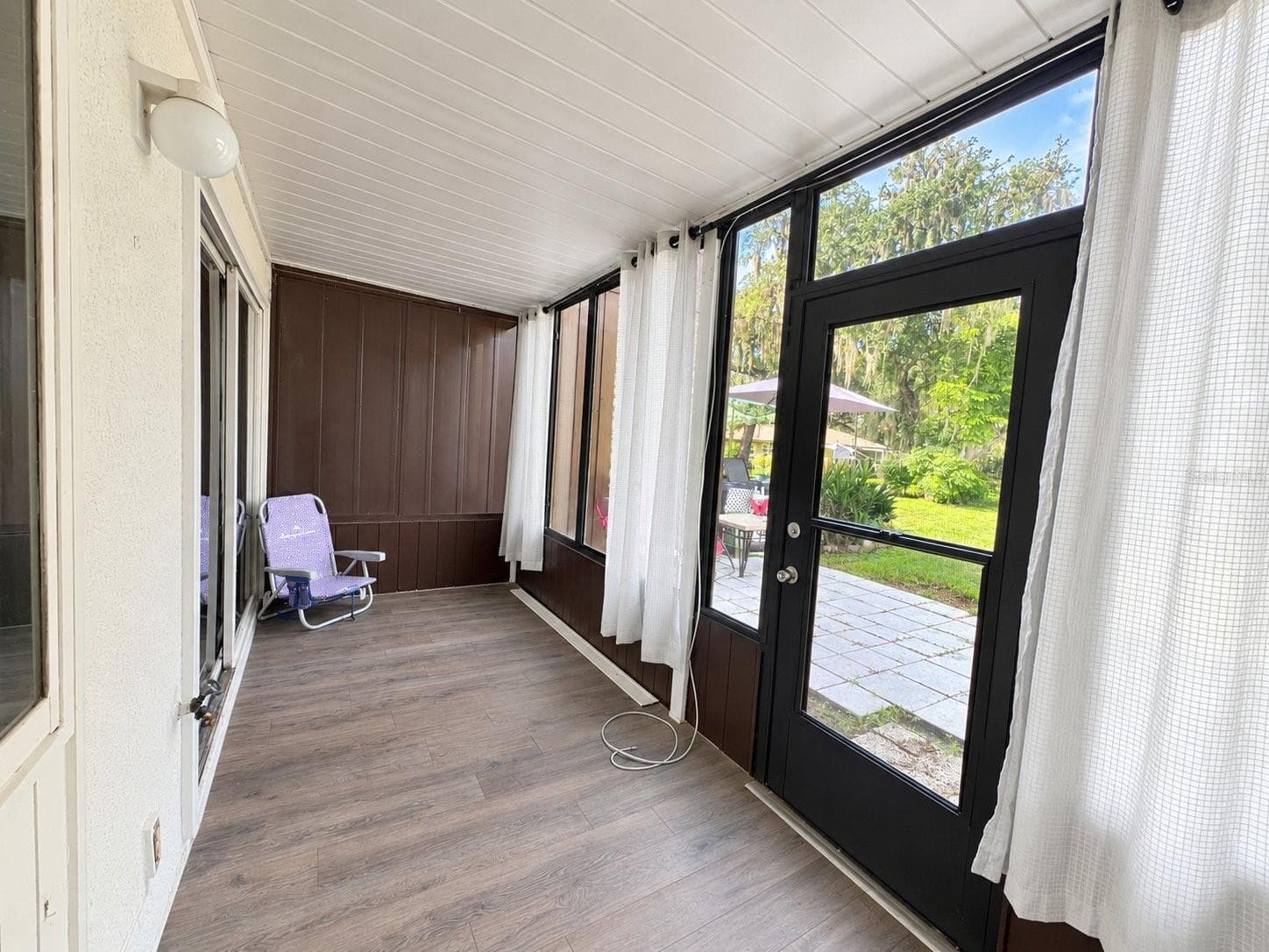inside patio with storage closet - 693 MIDWAY DR #A, OCALA