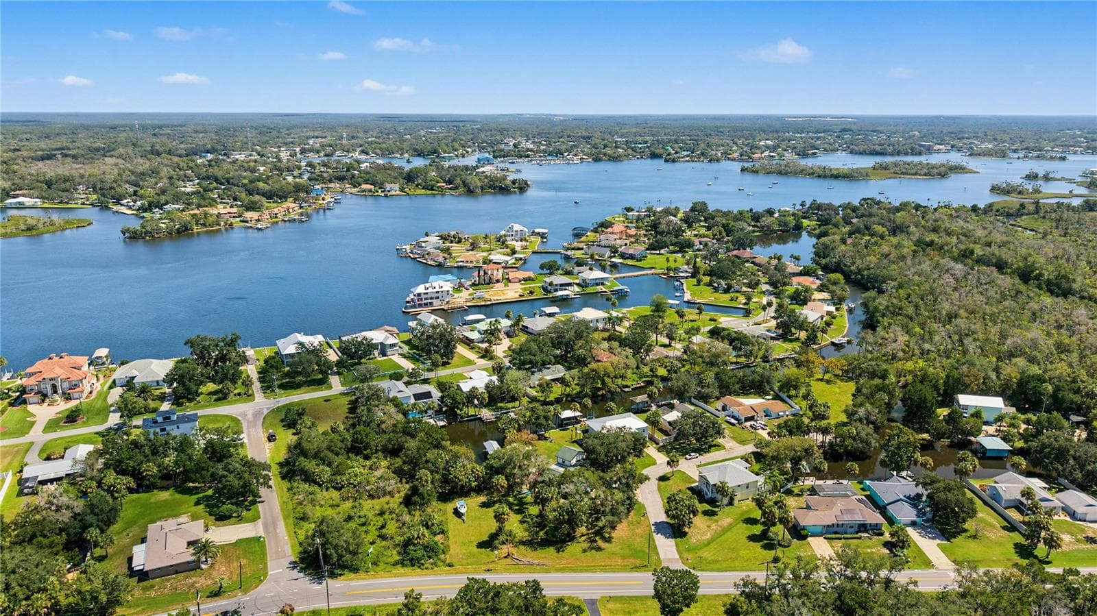 Aerial perspective showcasing the surrounding waterways and coastal Crystal River landscape. - 10933 W FORT ISLAND TRL, CRYSTAL RIVER