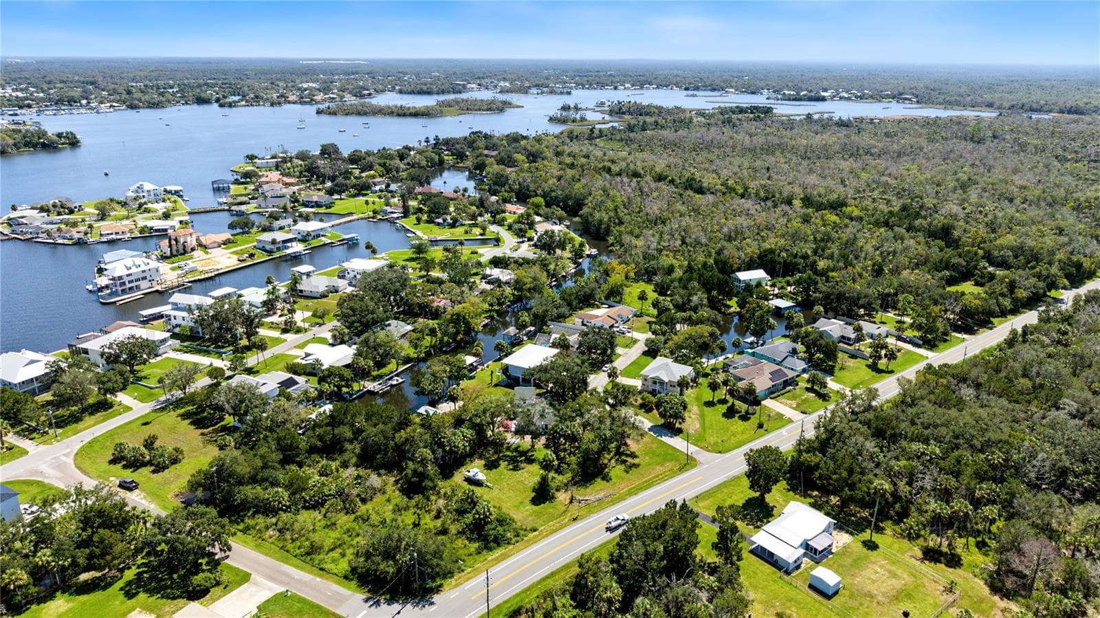 Expansive aerial view showcasing the network of waterways throughout the Fort Island area. - 10933 W FORT ISLAND TRL, CRYSTAL RIVER