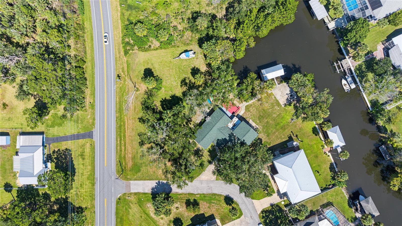 Aerial view providing perspective on the property's setting and surrounding properties. - 10933 W FORT ISLAND TRL, CRYSTAL RIVER