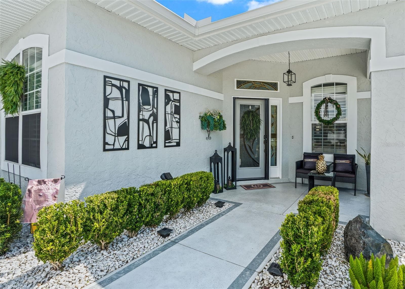 Covered front entrance w/Elegant front door w/Sidelight accent - 12056 SE 178TH ST, SUMMERFIELD