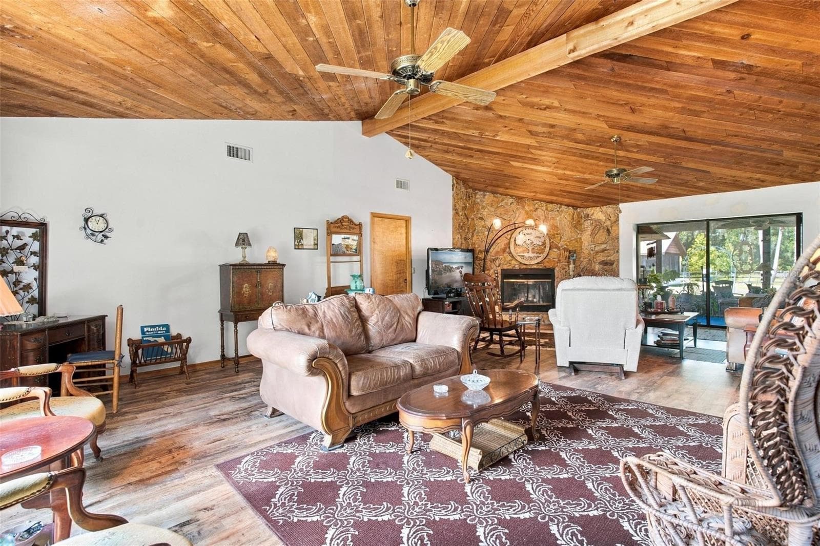 Living room with vaulted cedar ceilings. - 10131 SE 170TH LN, SUMMERFIELD