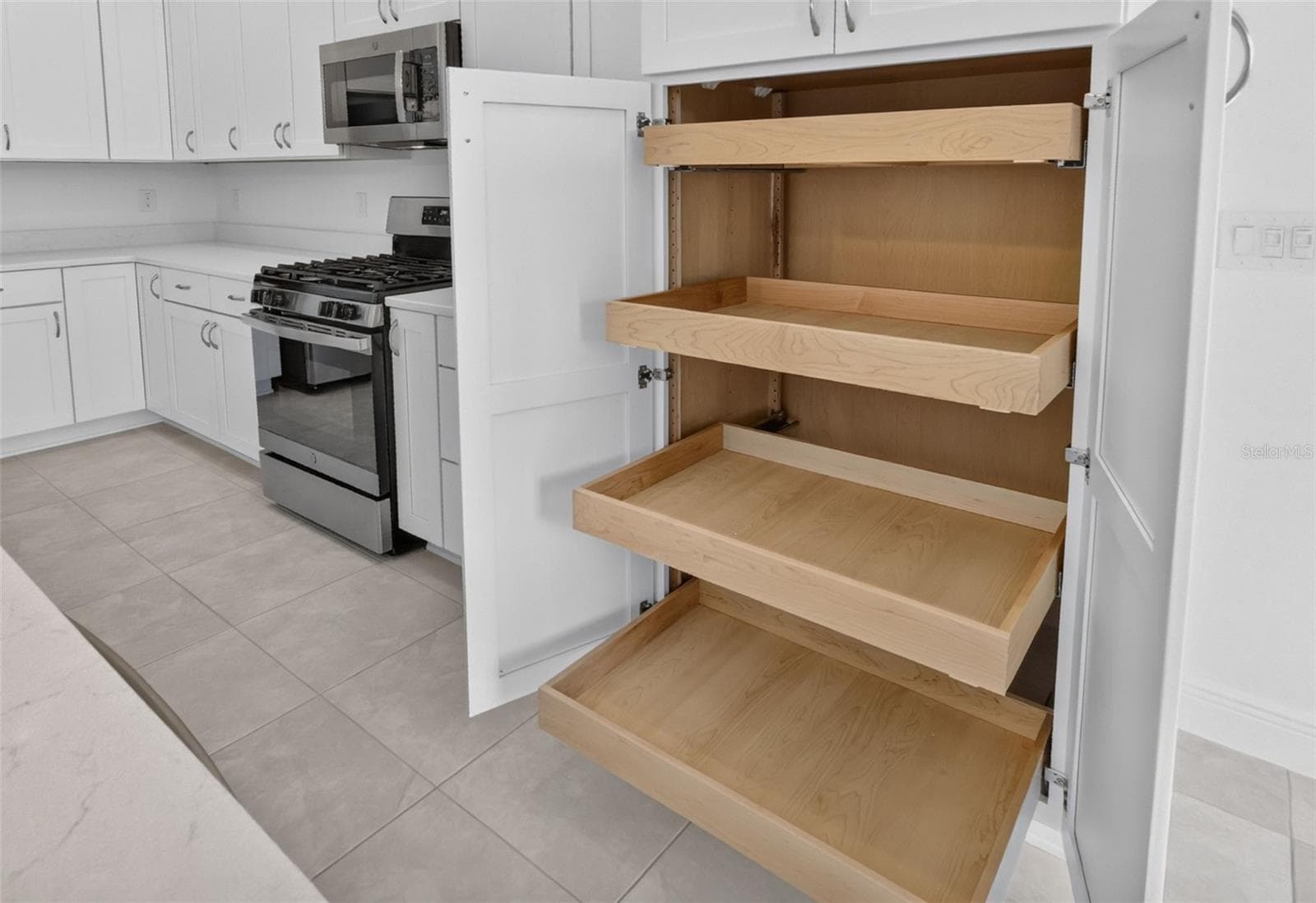 Kitchen with Built-In Double Pantry and Roll-Out Shelving - 654 SHIVERS LOOP, THE VILLAGES