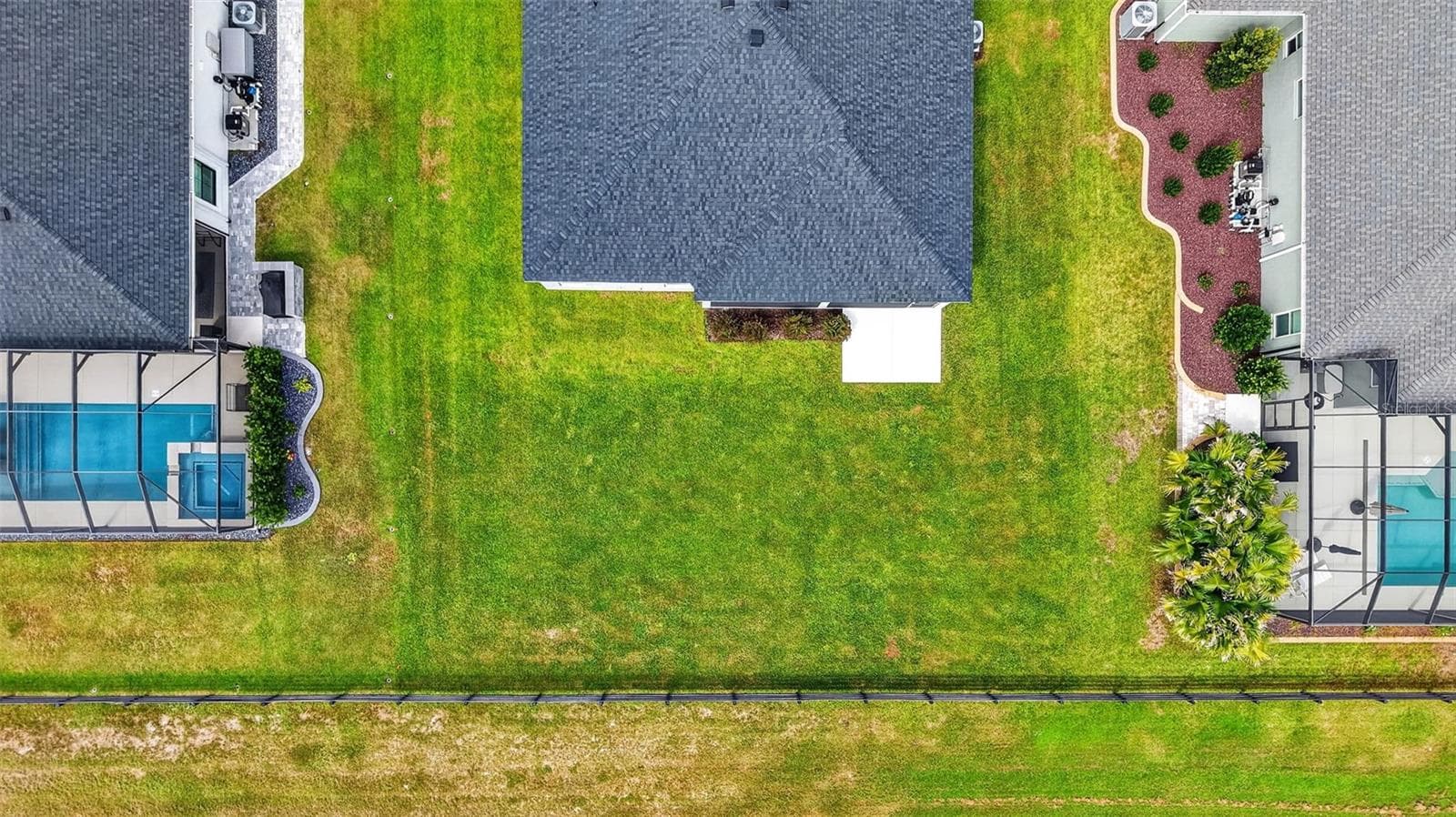 Aerial Rear Elevation with Spacious Rear Yard and ROOM FOR A POOL! - 654 SHIVERS LOOP, THE VILLAGES
