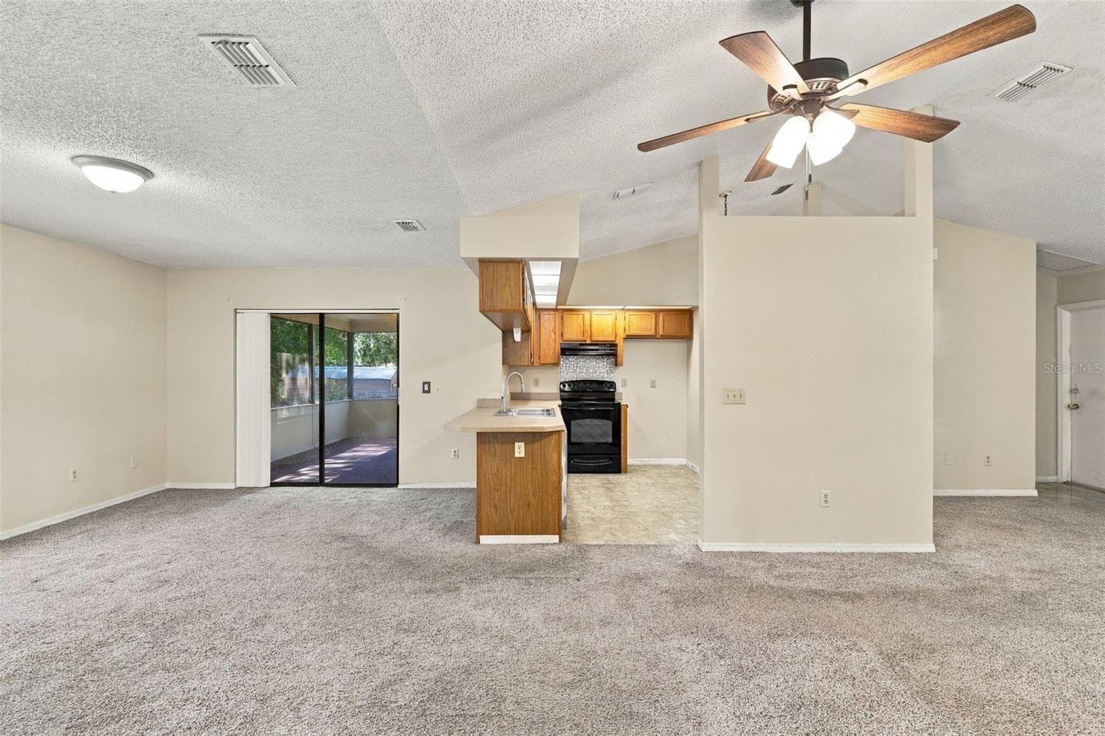 Dinning Room and Kitchen from Primary Bedroom - 1249 HOWLAND BLVD, DELTONA