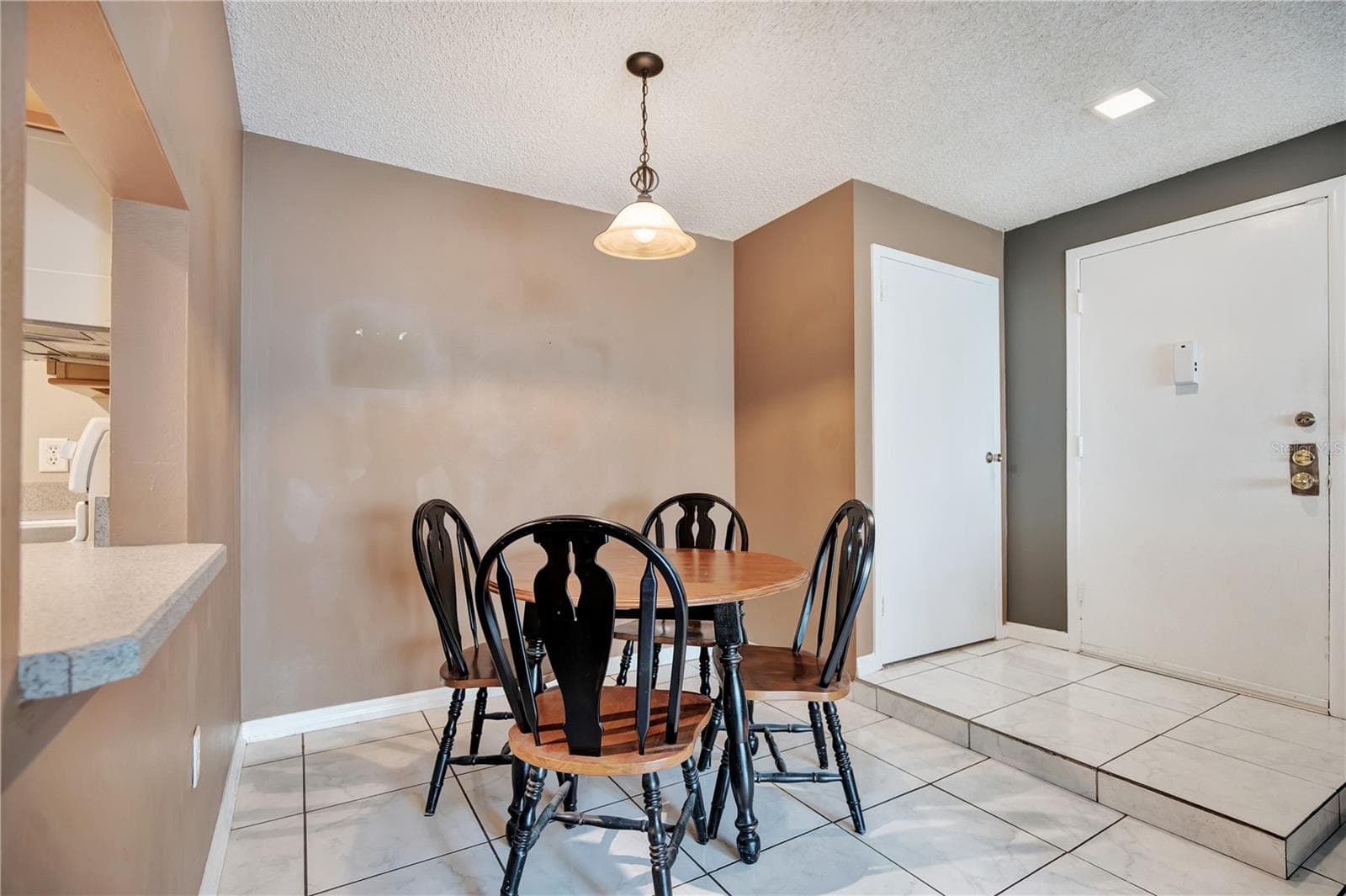 Dining Area/Entry Staged - 3278 S SEMORAN BLVD #12, ORLANDO