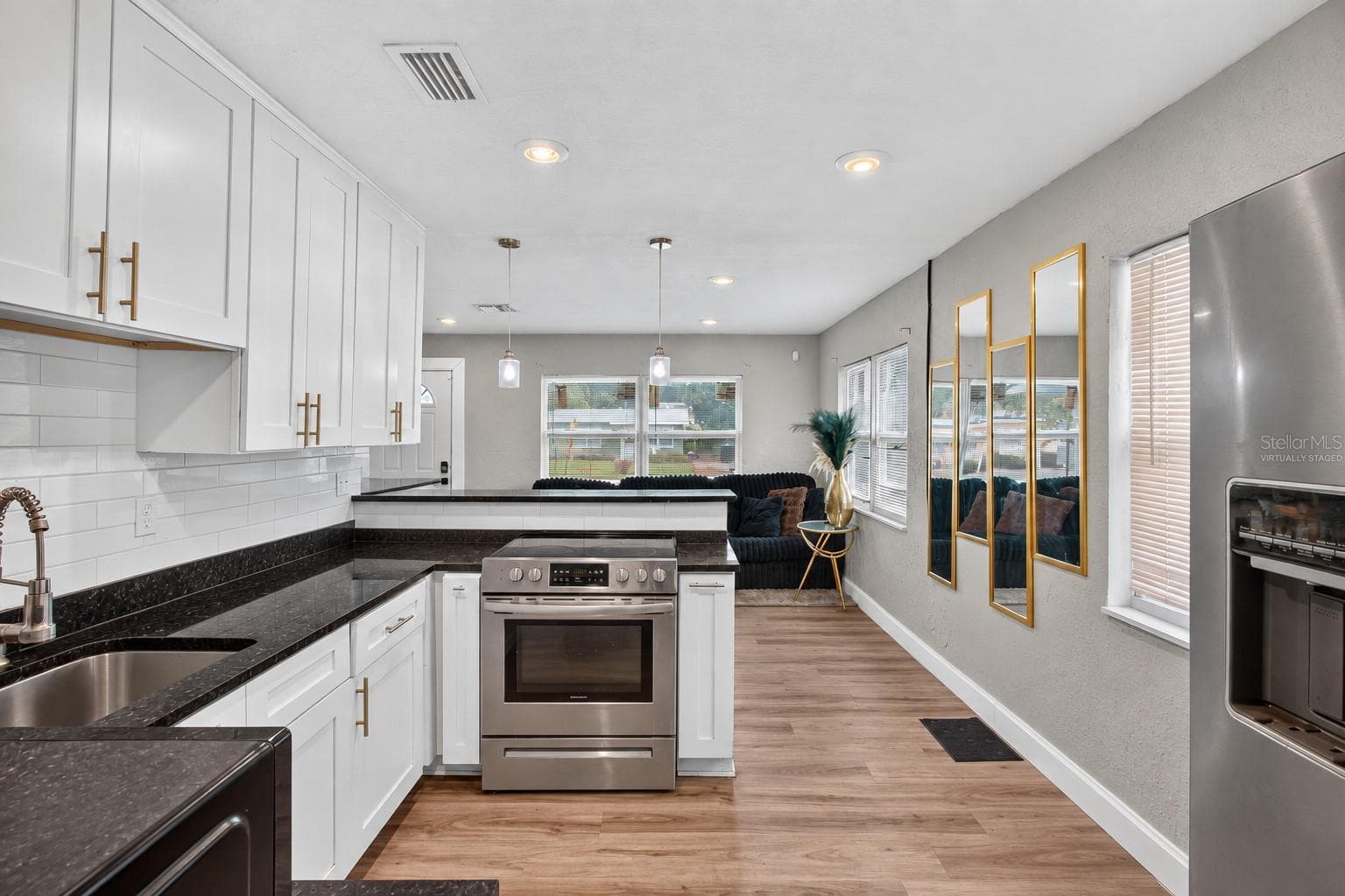 Virtually Staged. Personal Items digitally removed. Open Kitchen with breakfast bar - 2452 17TH AVE S, ST PETERSBURG