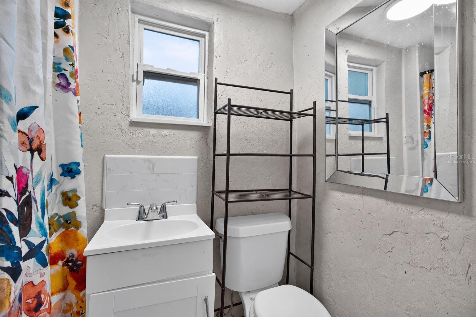 Virtually Staged. Personal Items digitally removed. En-Suite Bathroom - 2452 17TH AVE S, ST PETERSBURG