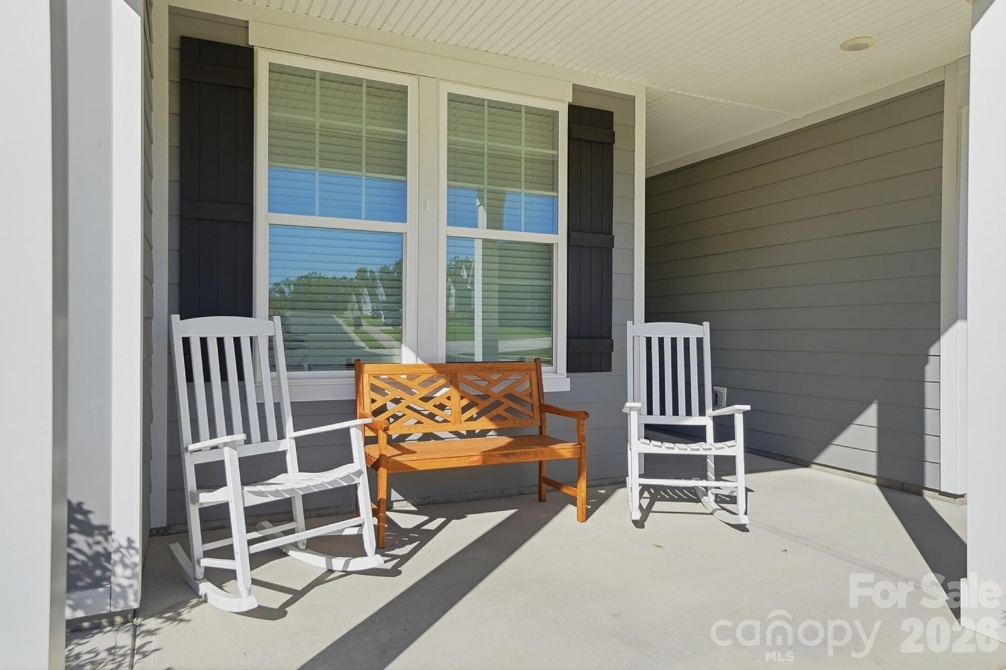 Welcoming rocking chair front porch - 8032 Longwaters Court, York
