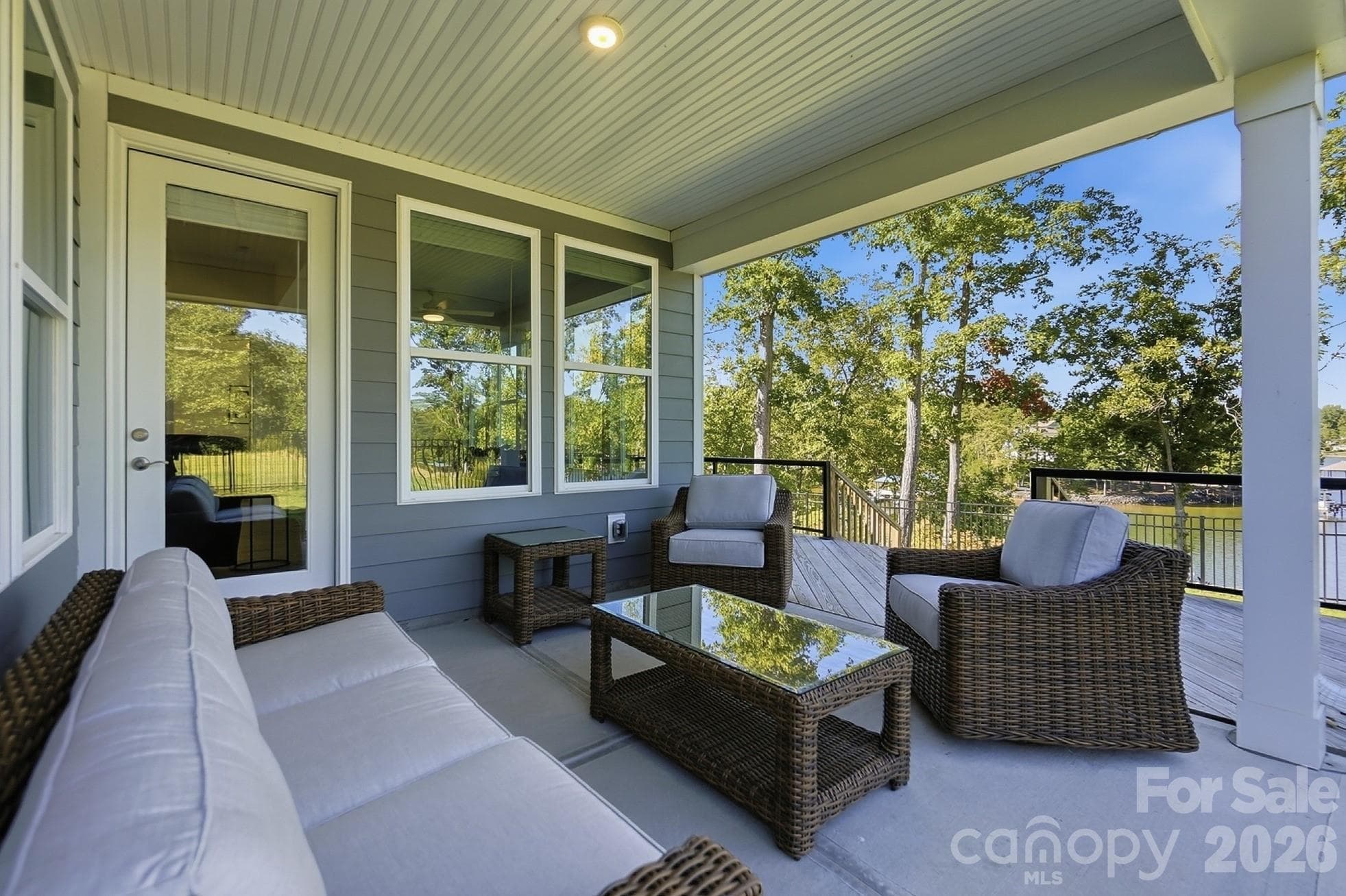 Outside, enjoy an aluminum-fenced backyard and an expanded back deck with aluminum railing and glass panels, providing an ideal spot to take in the scenery - 8032 Longwaters Court, York