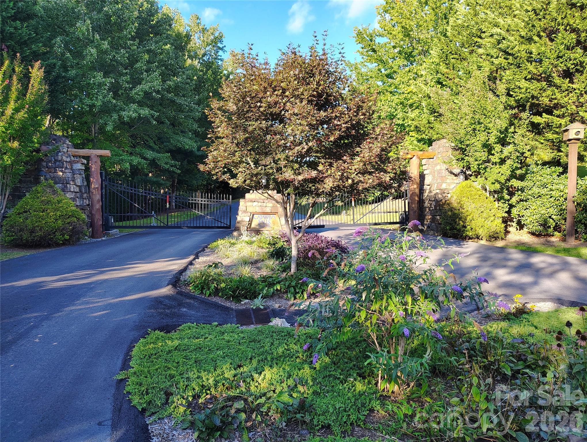 Beautiful landscaping, stone and woodwork await you - 304 Feather Falls Trail, Old Fort
