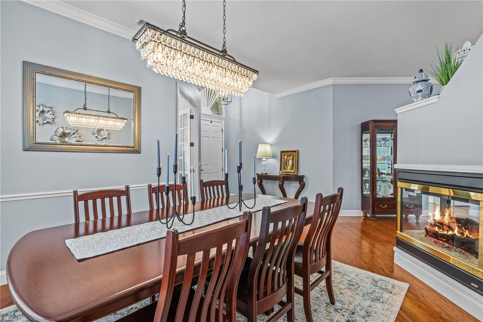 Gorgeous dining room light fixture coordinates with the chandelier in the den - 520 SOTHEBY WAY, DEBARY