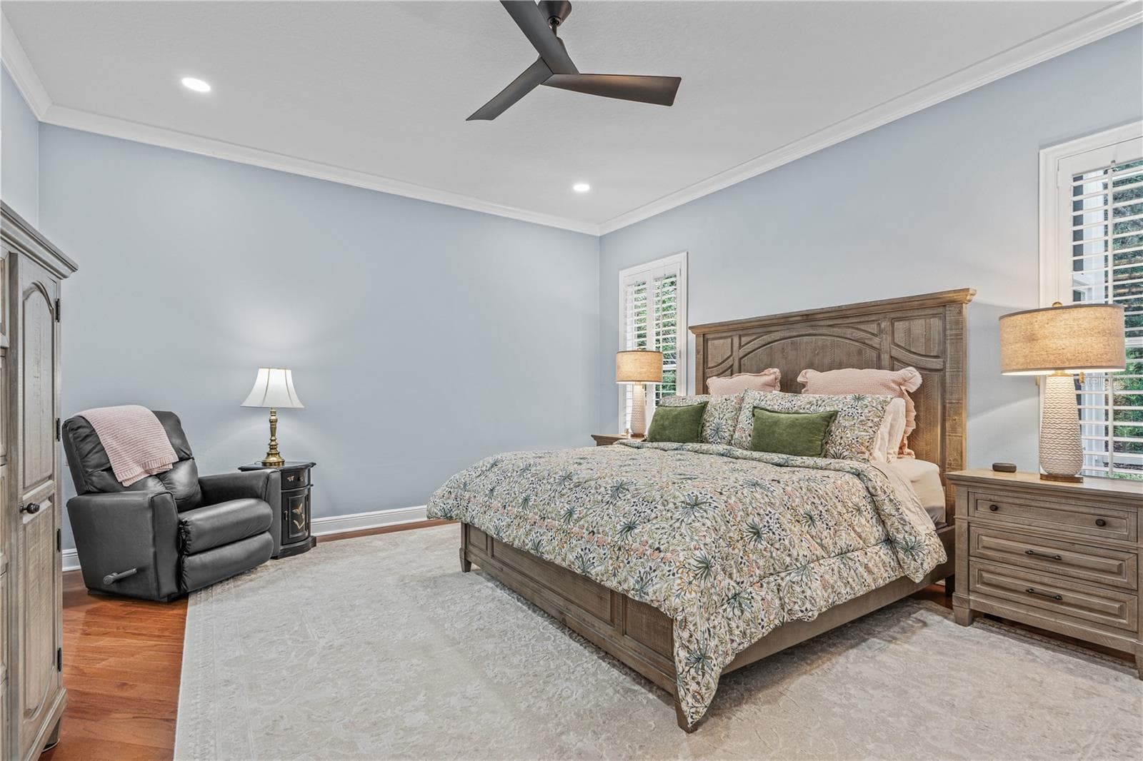 Hardwood floors extend to the primary bedroom; Additional can lights were added as well as an updated ceiling fan during the 2024 renovations - 520 SOTHEBY WAY, DEBARY