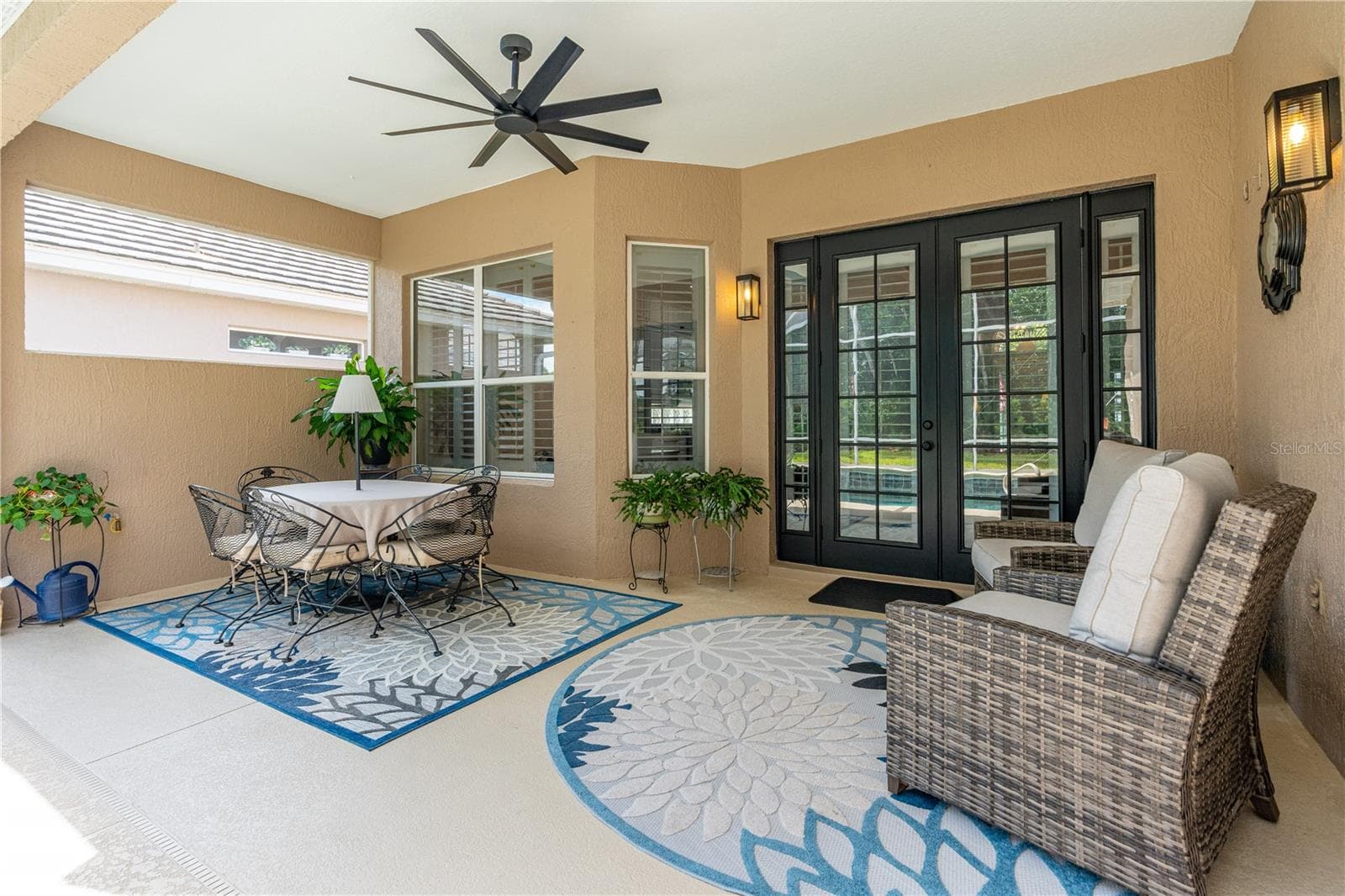The relaxing back porch/lanai; French doors lead into the Great Room - 520 SOTHEBY WAY, DEBARY