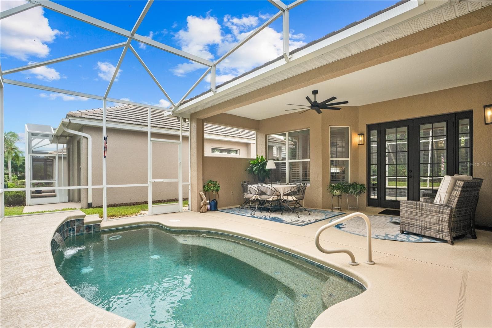 Lots of privacy on the back porch/lanai area; The exterior wall next to the table is plumbed for natural gas for installation of summer kitchen - 520 SOTHEBY WAY, DEBARY