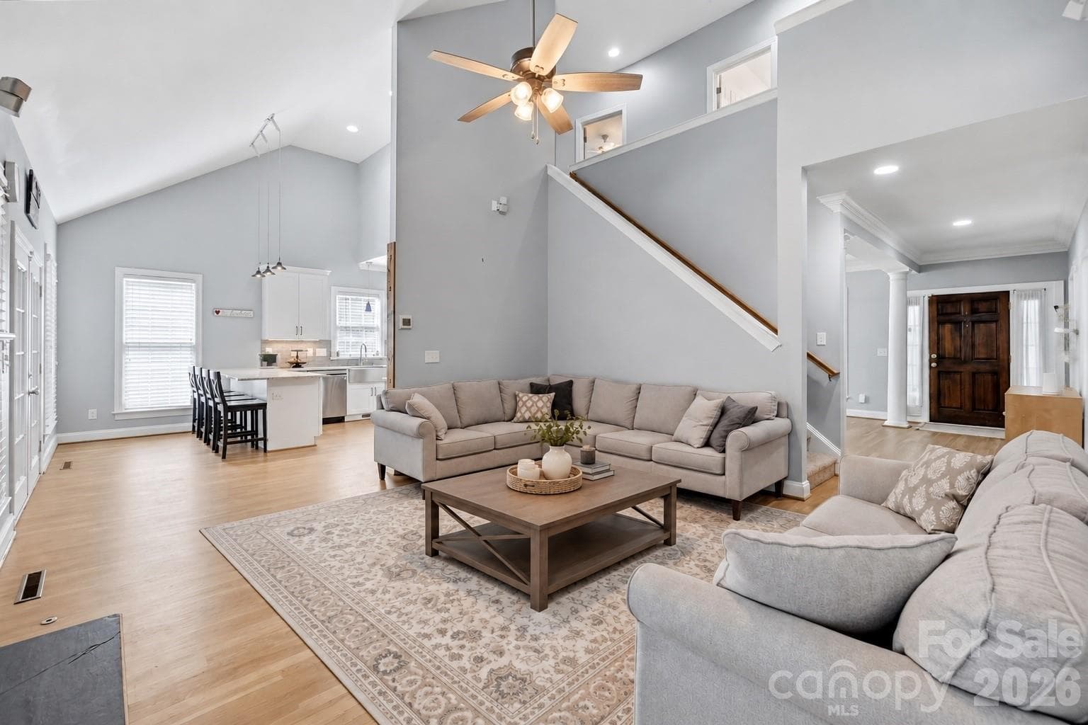 Gorgeous living with virtually staged rug and coffee table - 7702 Spanish Oaks Drive, Waxhaw