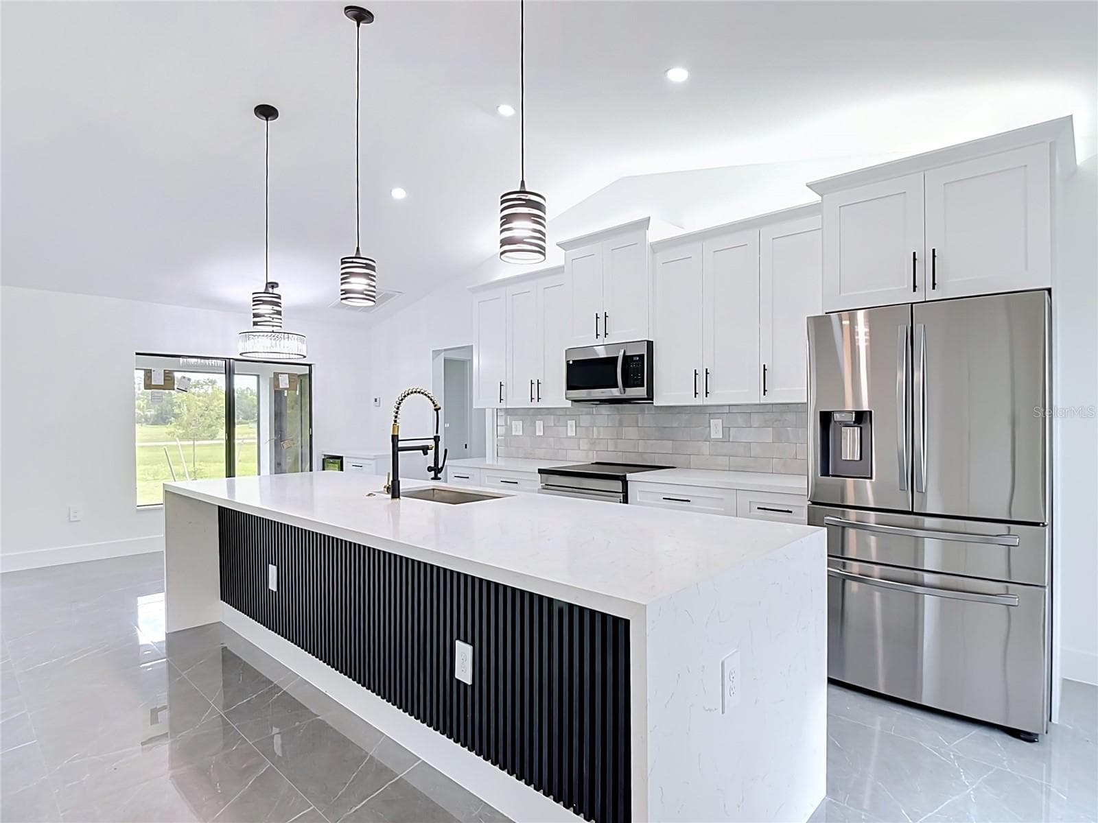 Kitchen featuring all appliances including 2 drawer refrigerator/freezer - 3613 NW 47TH LN, CAPE CORAL
