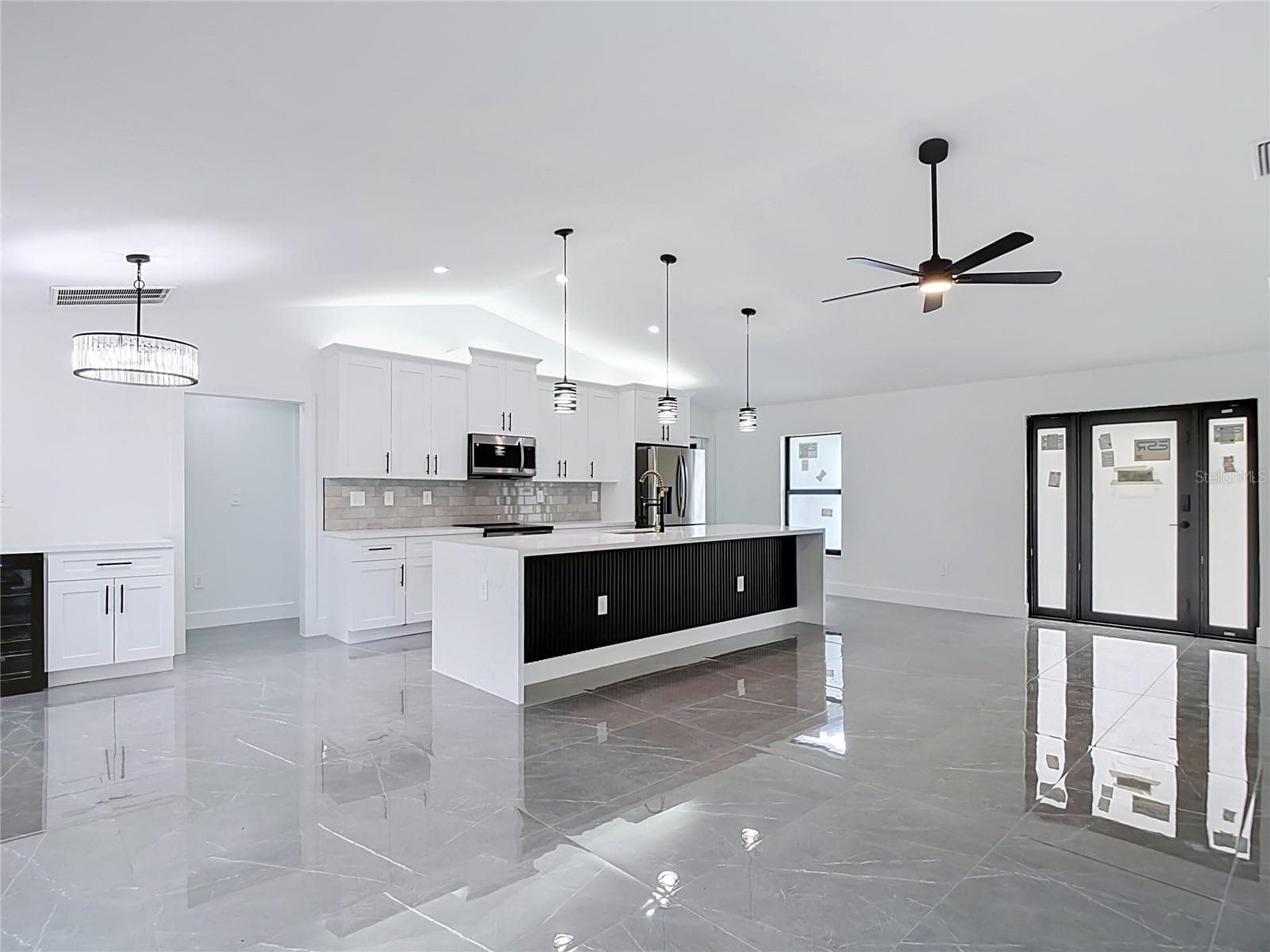 Kitchen and sliding doors to the lanai - 3613 NW 47TH LN, CAPE CORAL
