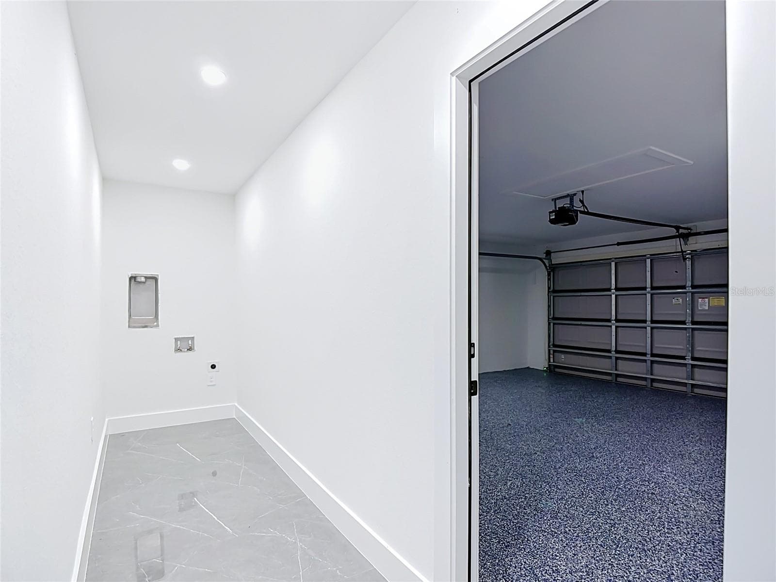 View of indoor laundry area and garage to the right - 3613 NW 47TH LN, CAPE CORAL