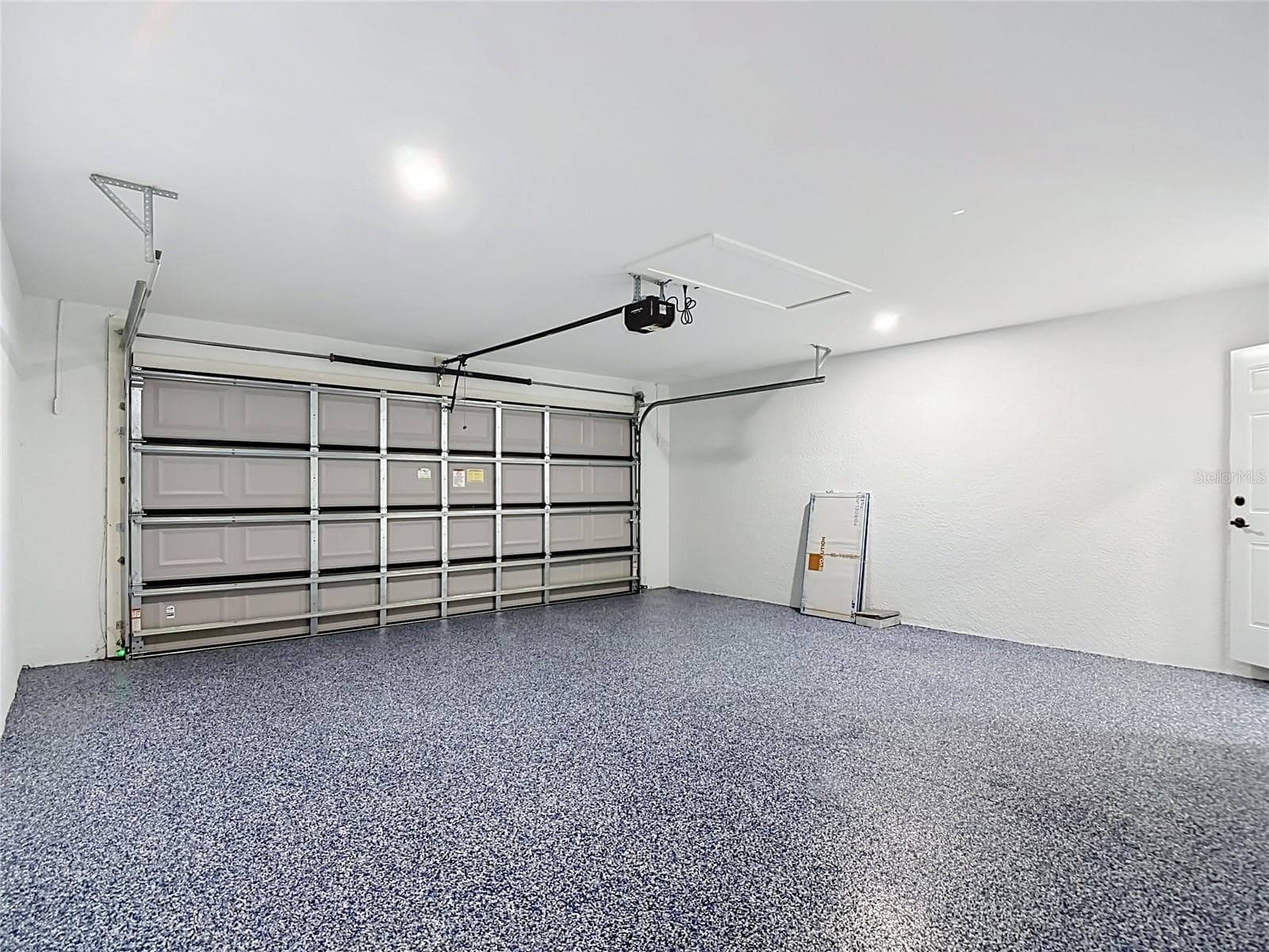 Another view of garage including the attic storage area - 3613 NW 47TH LN, CAPE CORAL