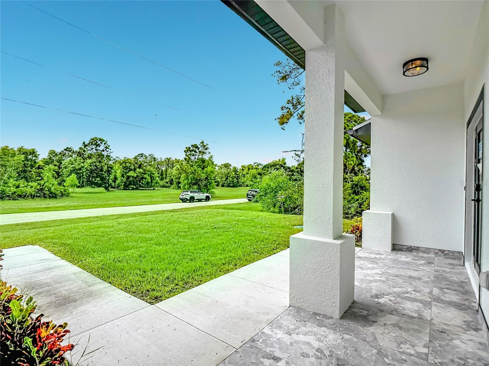 Beautiful views of front yard - 3613 NW 47TH LN, CAPE CORAL