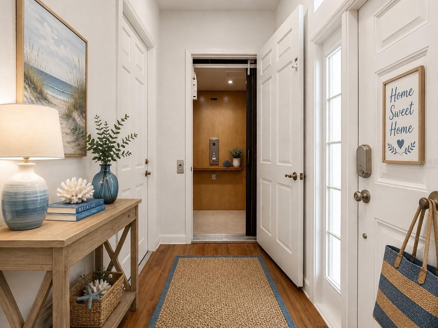 Garage door and Front Door entrance - Elevator Access - virtually staged - 1338 EMERALD DUNES DR #35, SUN CITY CENTER