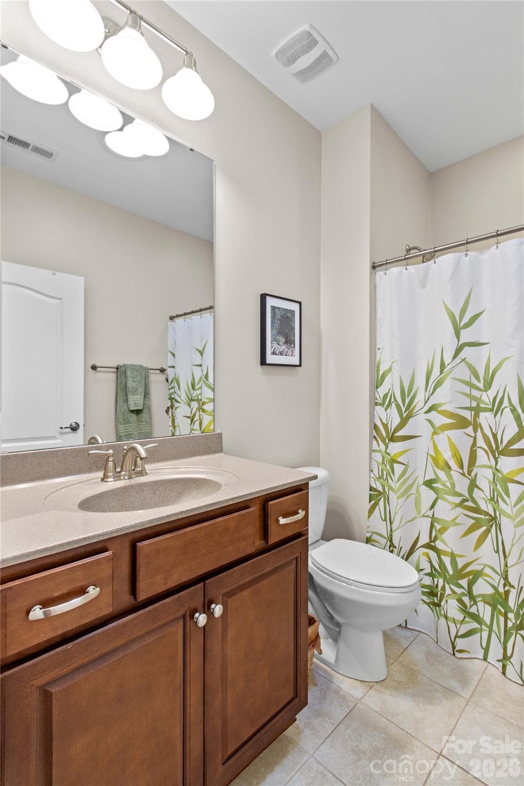 Full bathroom includes a tub/shower, tile floor, and a gentleman's height vanity for comfort. - 18114 Ebenezer Drive, Cornelius