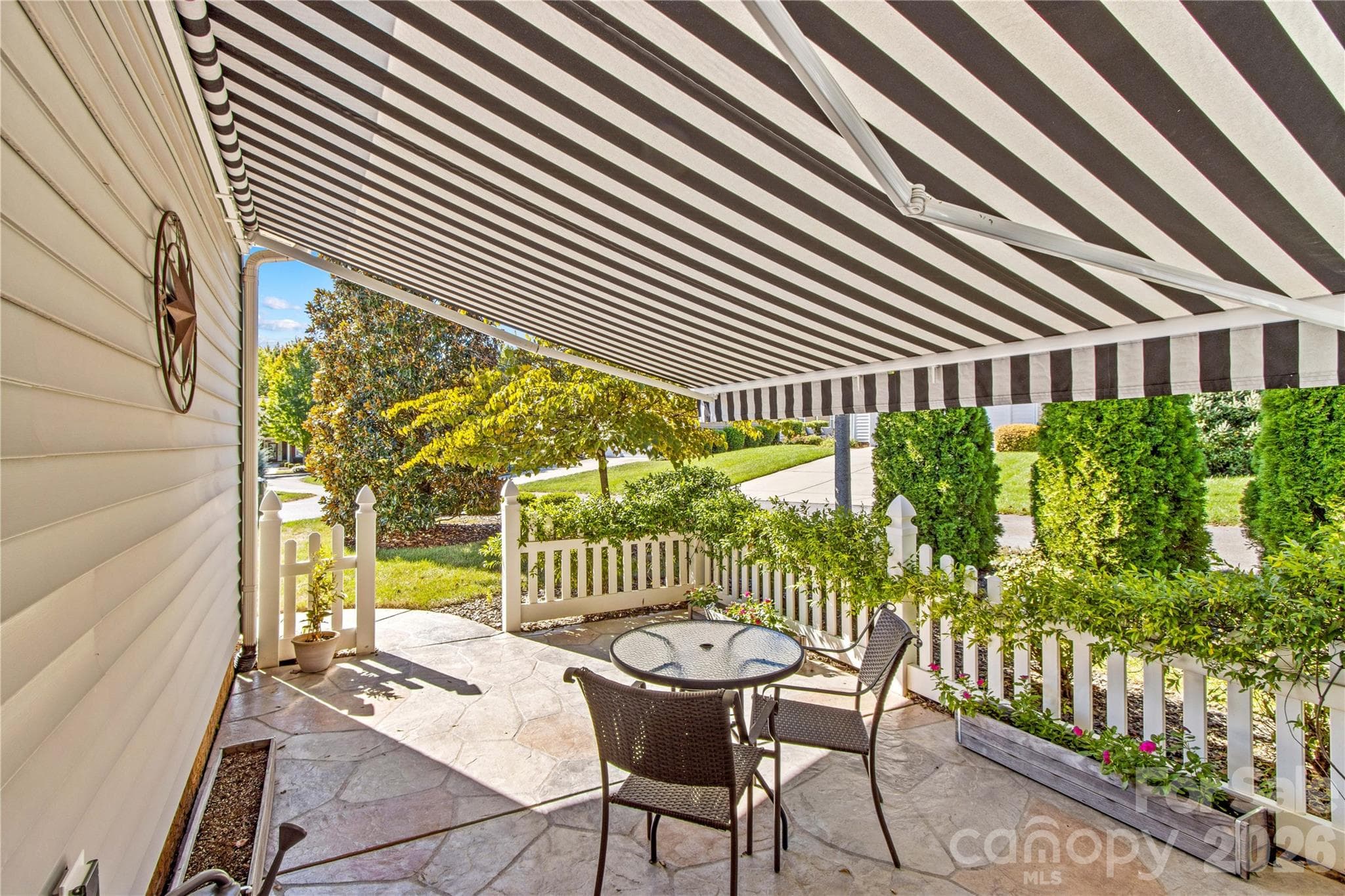An automated awning allows you to enjoy the Carolina weather even in the hottest of days. - 18114 Ebenezer Drive, Cornelius