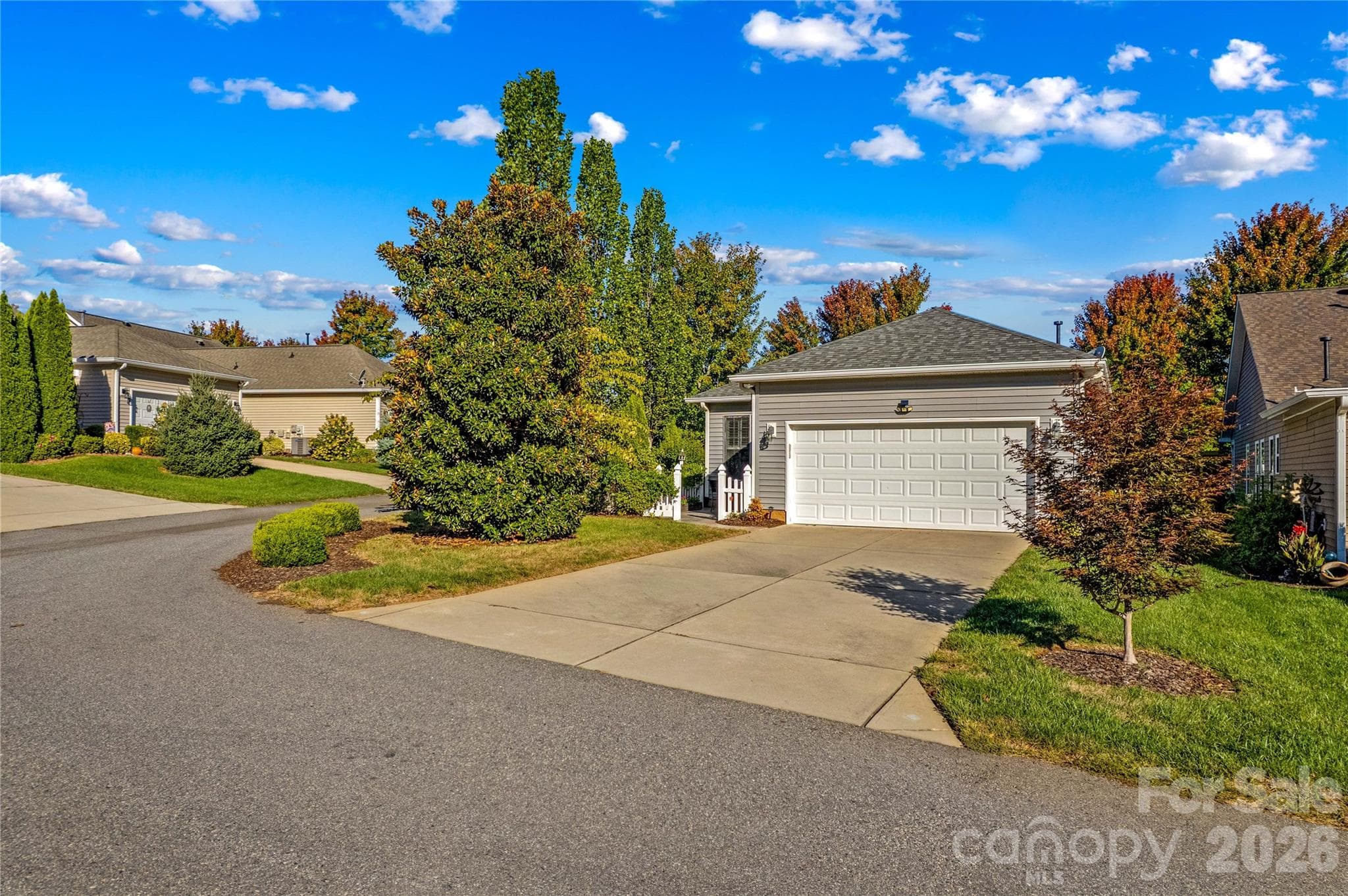 Home has plenty of parking for guests including a two-car attached garage and an extended driveway. - 18114 Ebenezer Drive, Cornelius