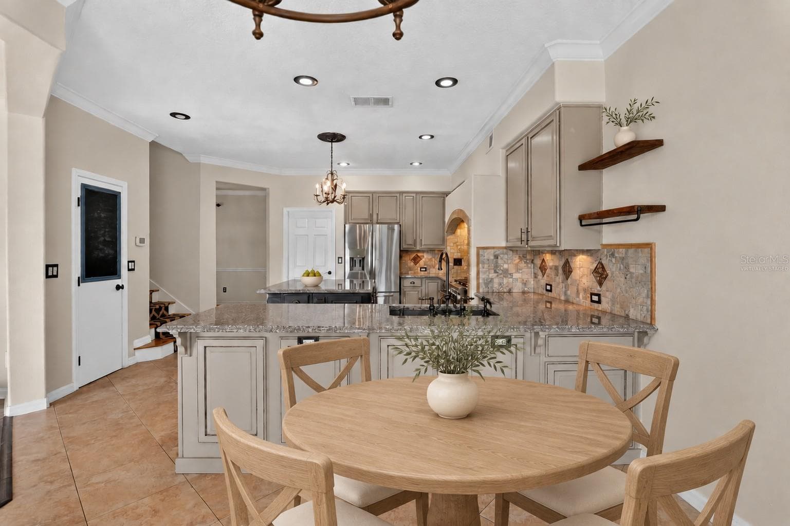 Virtually staged: Dining area adjoining the kitchen. - 2109 WEMBLEY PL, OVIEDO