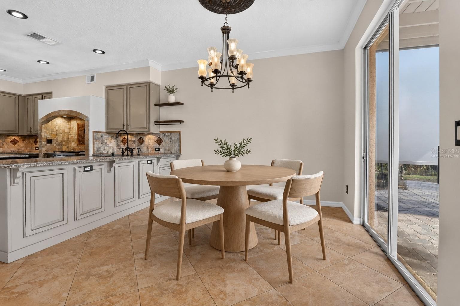 Virtually staged: Alternate view of the kitchen dining area. - 2109 WEMBLEY PL, OVIEDO