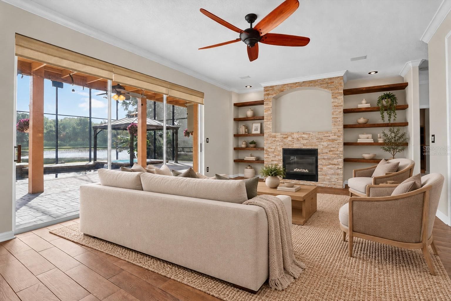 Virtually staged: Living room with views toward the pool. - 2109 WEMBLEY PL, OVIEDO