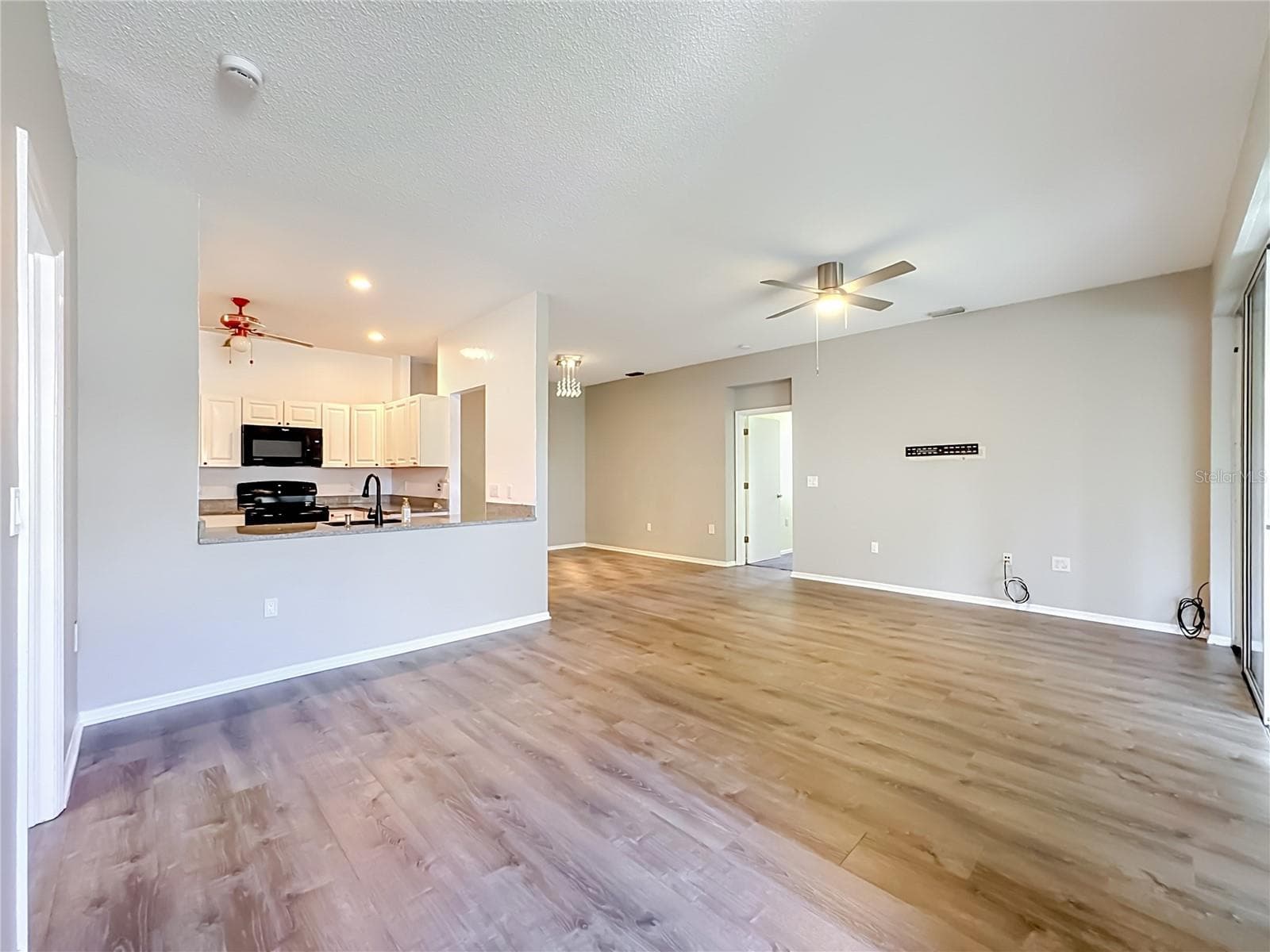 Great room with kitchen and dining room to the left. - 3308 60TH AVE W, BRADENTON