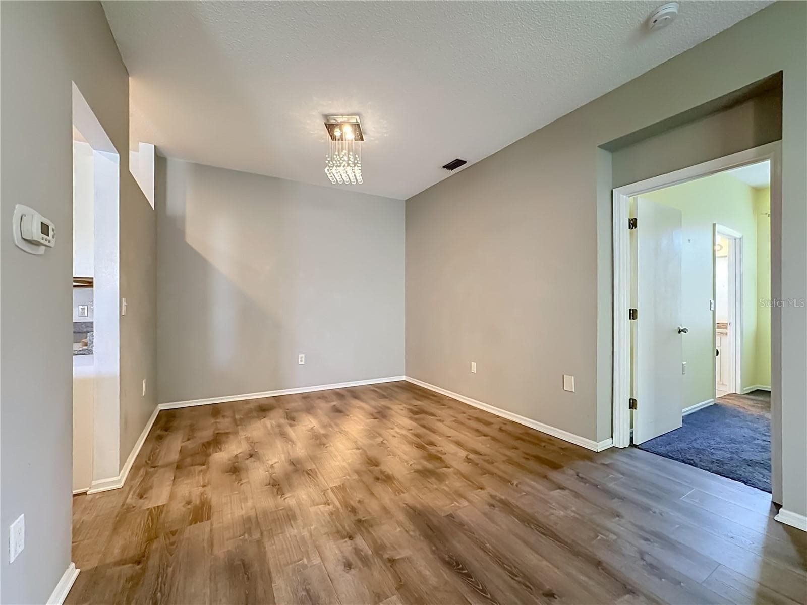 Dining room with updated light fixture. - 3308 60TH AVE W, BRADENTON