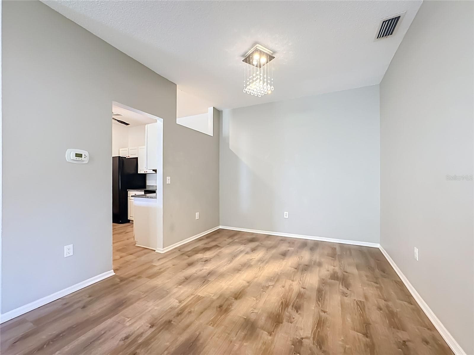 Closer view of the dining room with kitchen entrance to the left. - 3308 60TH AVE W, BRADENTON