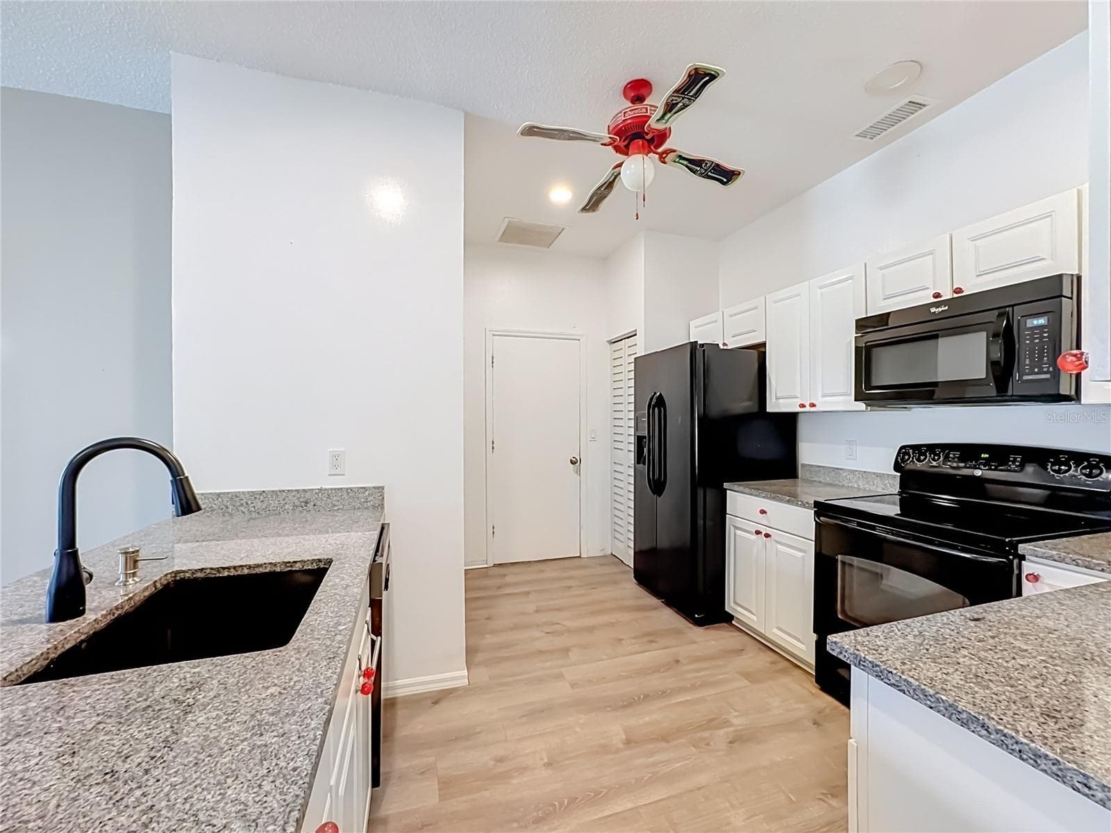 Kitchen features granite counters, upgraded sink and faucet. - 3308 60TH AVE W, BRADENTON