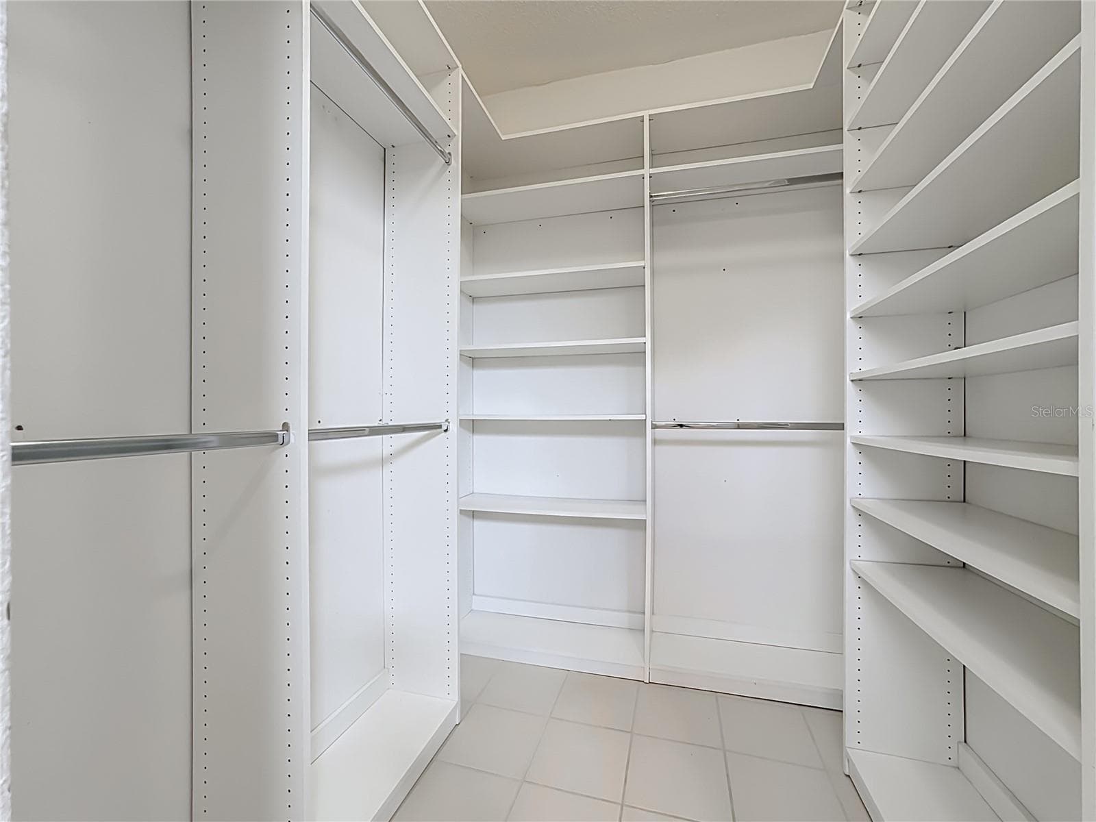Primary bedroom custom built closet. - 3308 60TH AVE W, BRADENTON