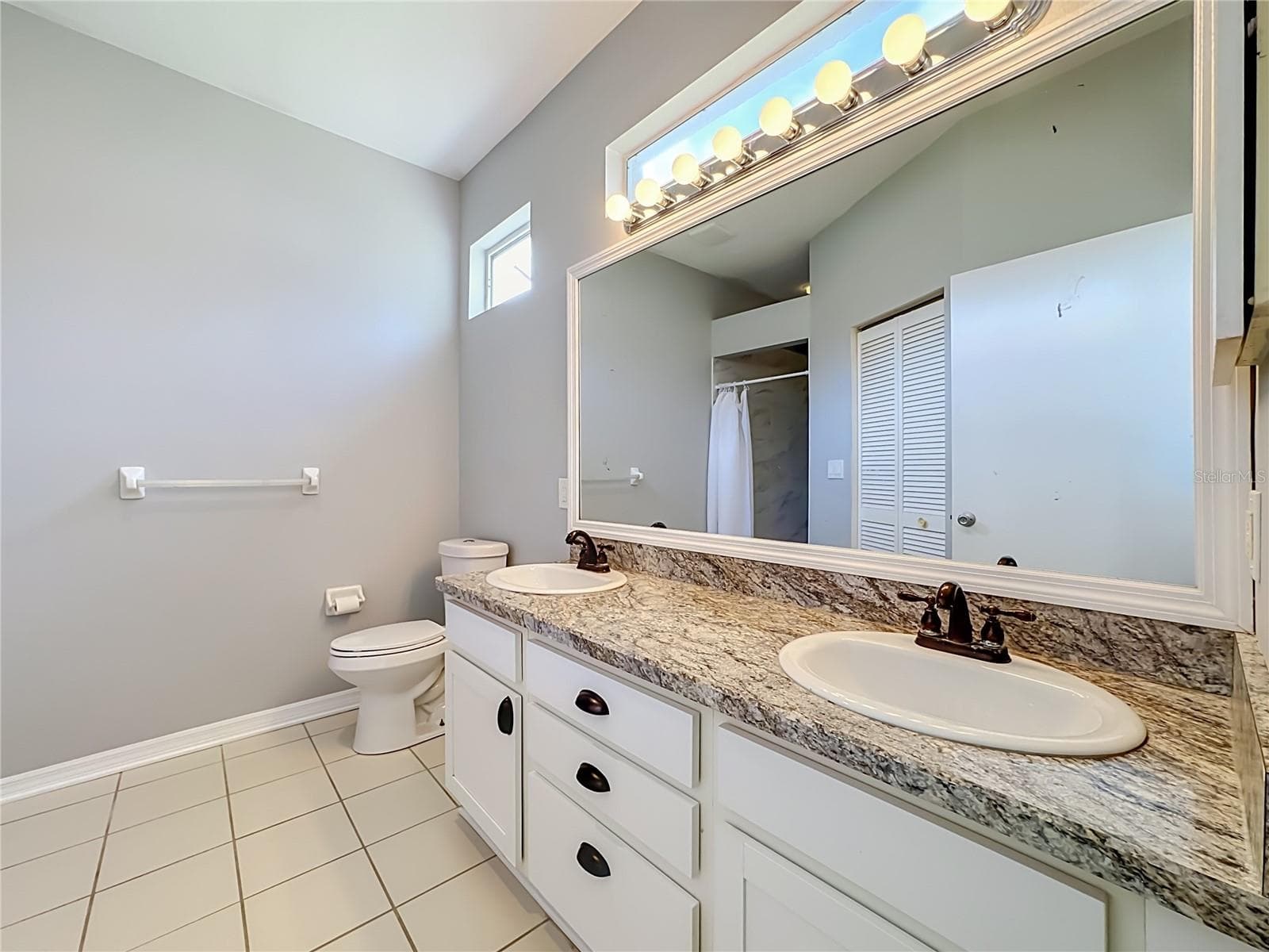 Primary bathroom with dual sinks and BRAND NEW walk-in shower. - 3308 60TH AVE W, BRADENTON