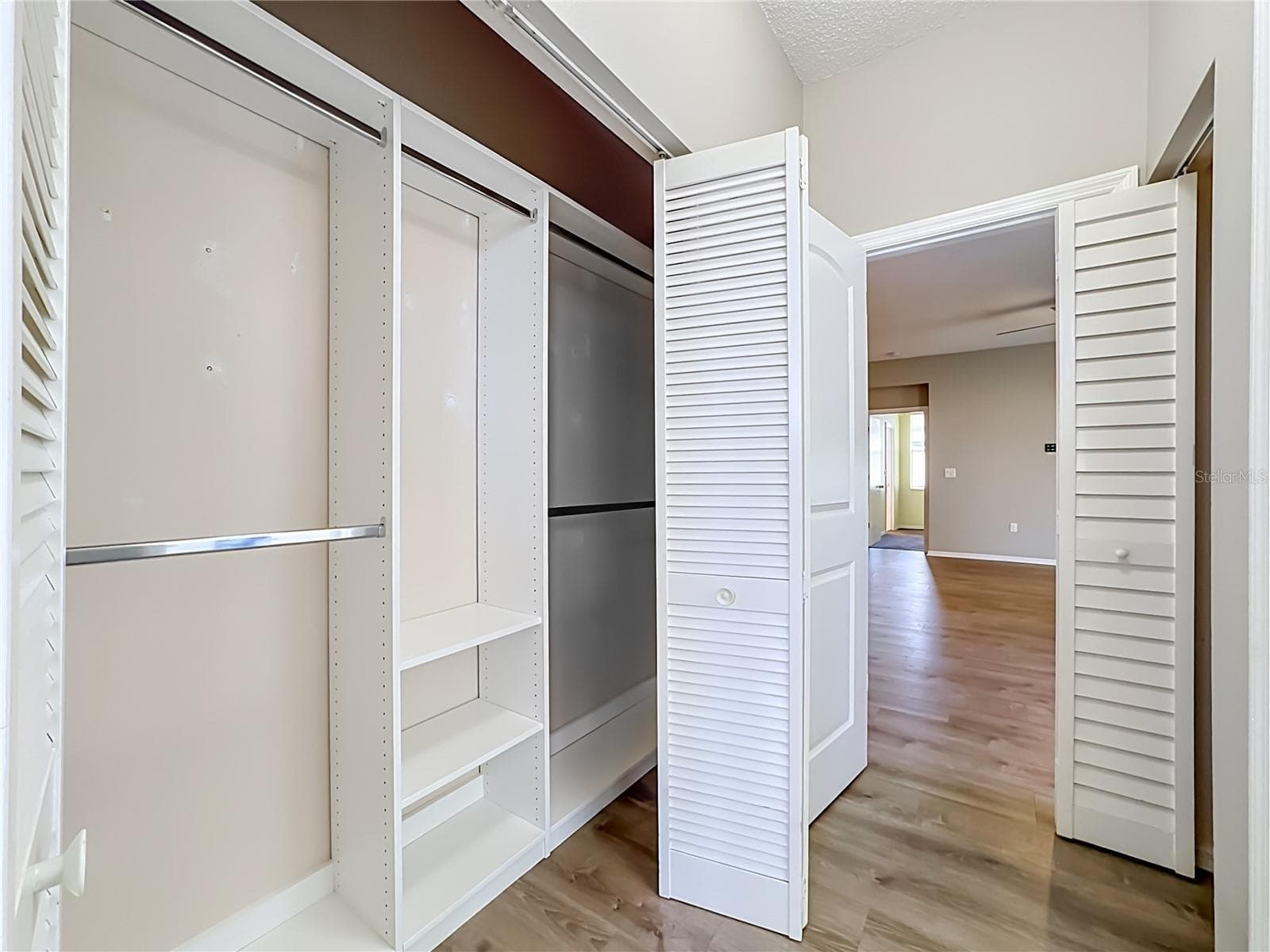 Guest bedroom closet with custom shelving. - 3308 60TH AVE W, BRADENTON