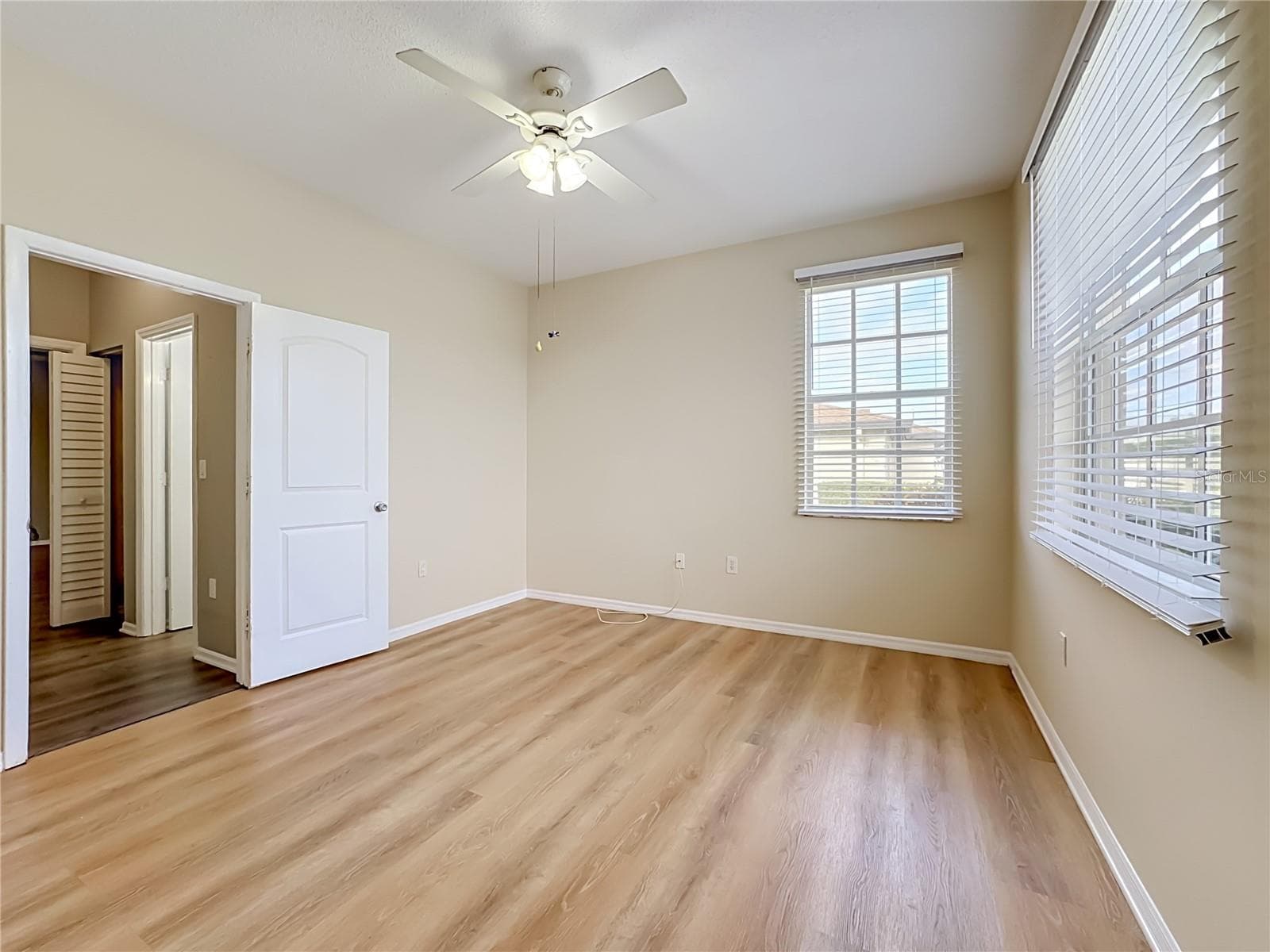 Luxury vinyl plank flooring in guest bedroom. - 3308 60TH AVE W, BRADENTON
