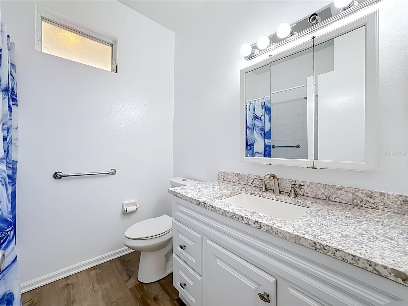 Guest bathroom with newer toilet grab bars by toilet and in tub/shower. - 3308 60TH AVE W, BRADENTON
